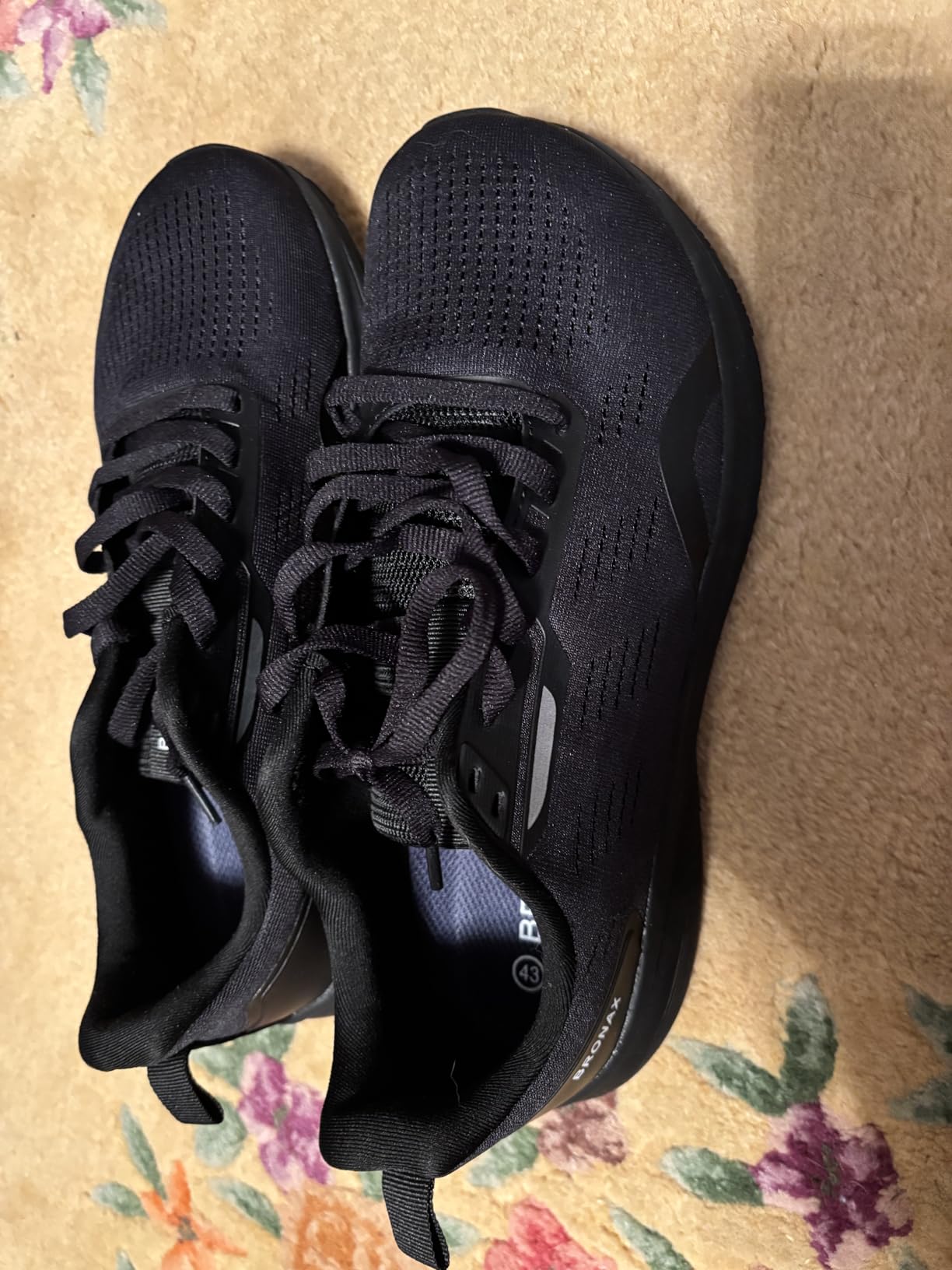 Side view of BRONAX running shoes showing mesh construction and profile design