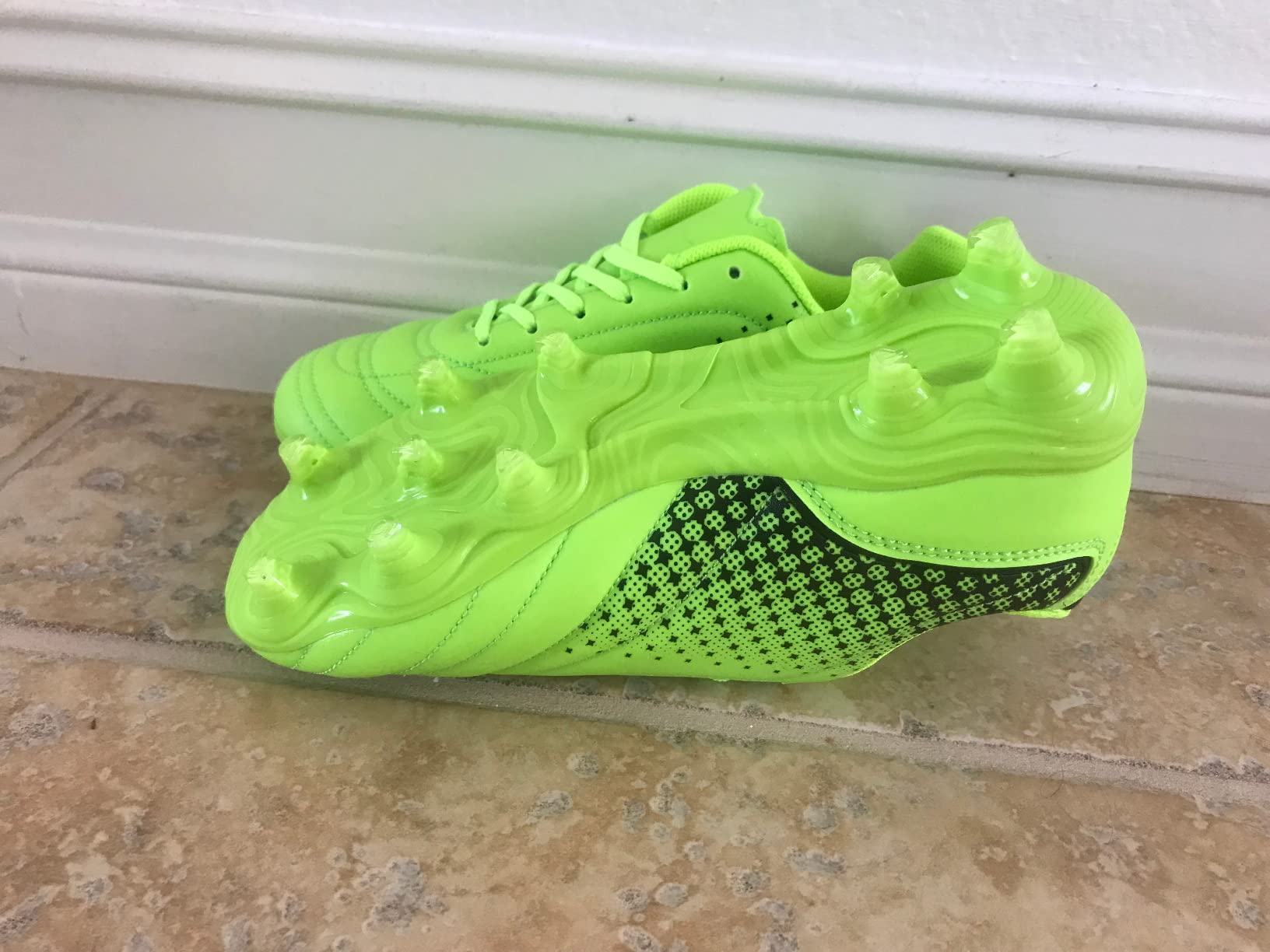 LIZRHA soccer cleats on grass field showing cleat interaction with natural turf