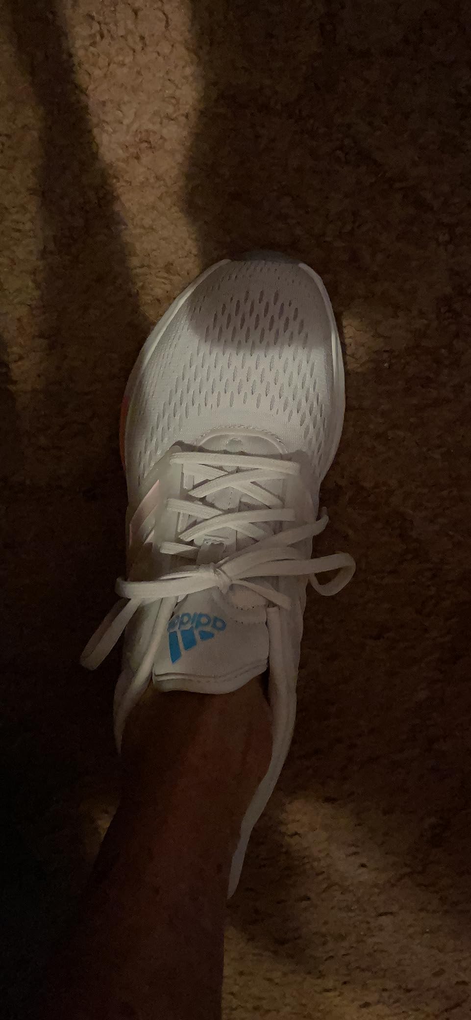 Lifestyle shot of adidas Eq21 being worn during daily activities showing versatile styling