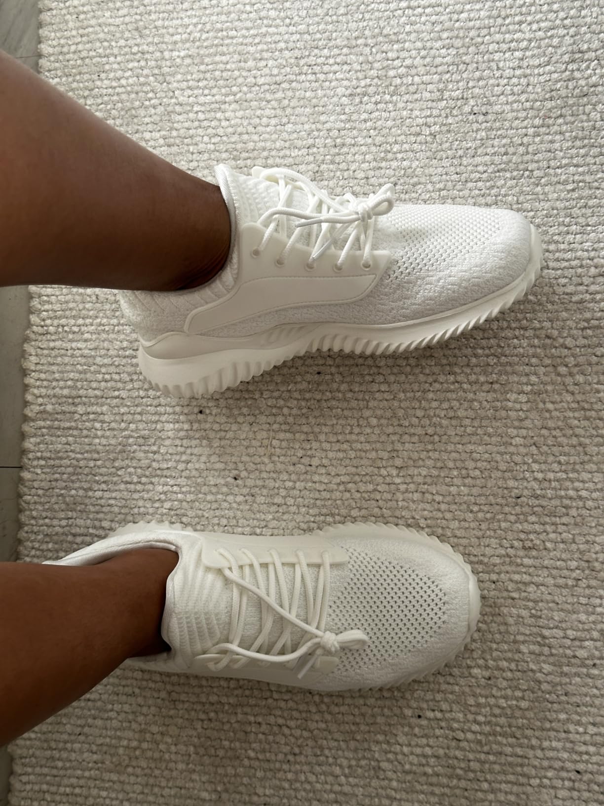 Women's white memory foam tennis shoes showing mesh upper and slip-on design