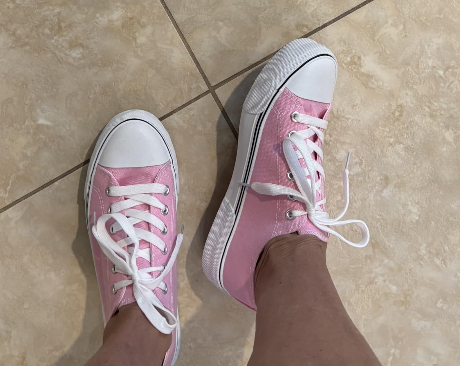 Bottom sole view of Adokoo sneakers showing tread pattern and grip design