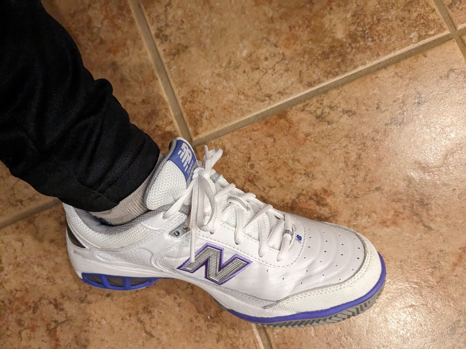 New Balance Women's 806 V1 Tennis Shoe white with purple accents showing court-ready design