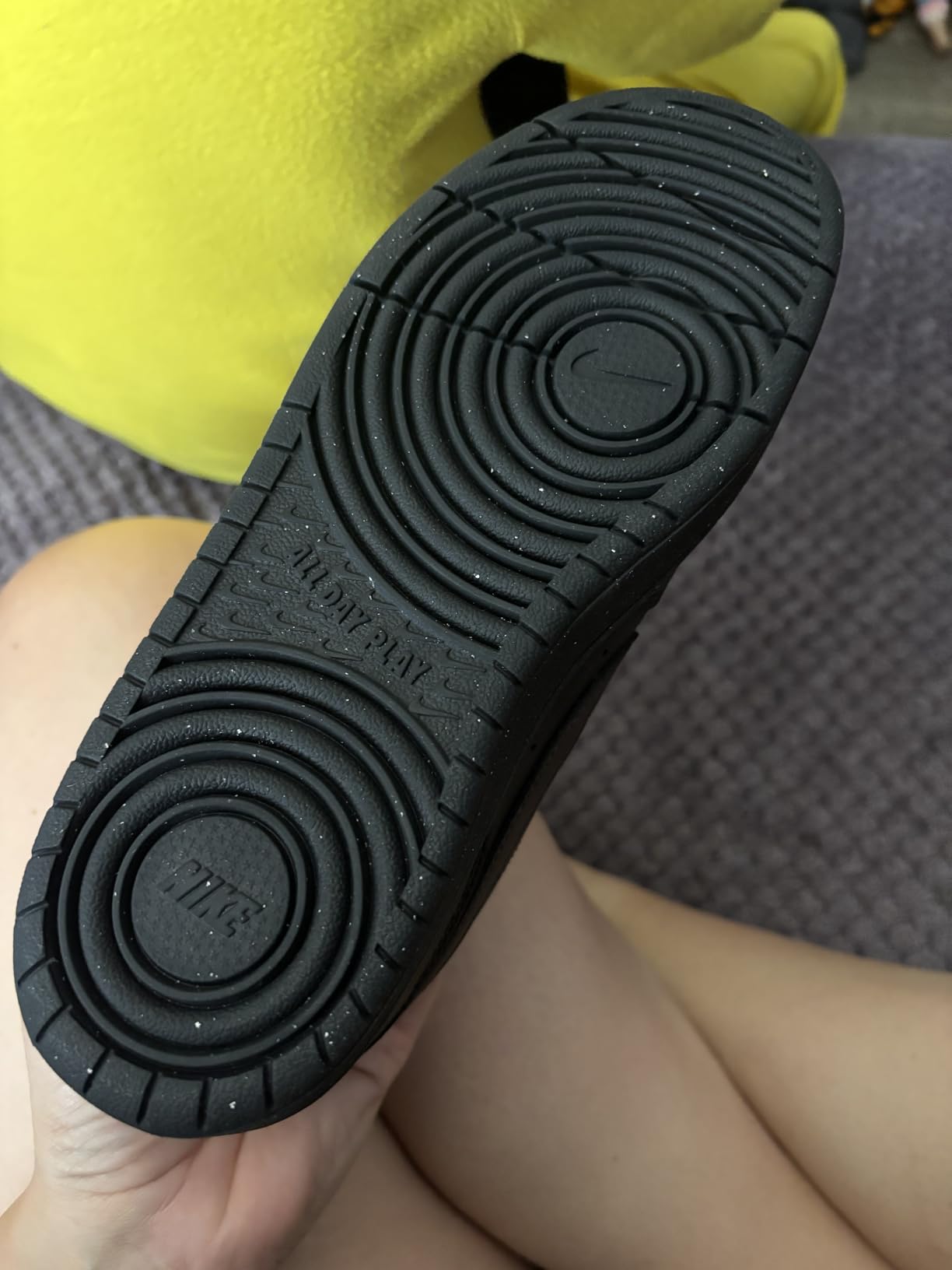 Side view of Nike Court Borough Low showing synthetic upper construction and rubber outsole design
