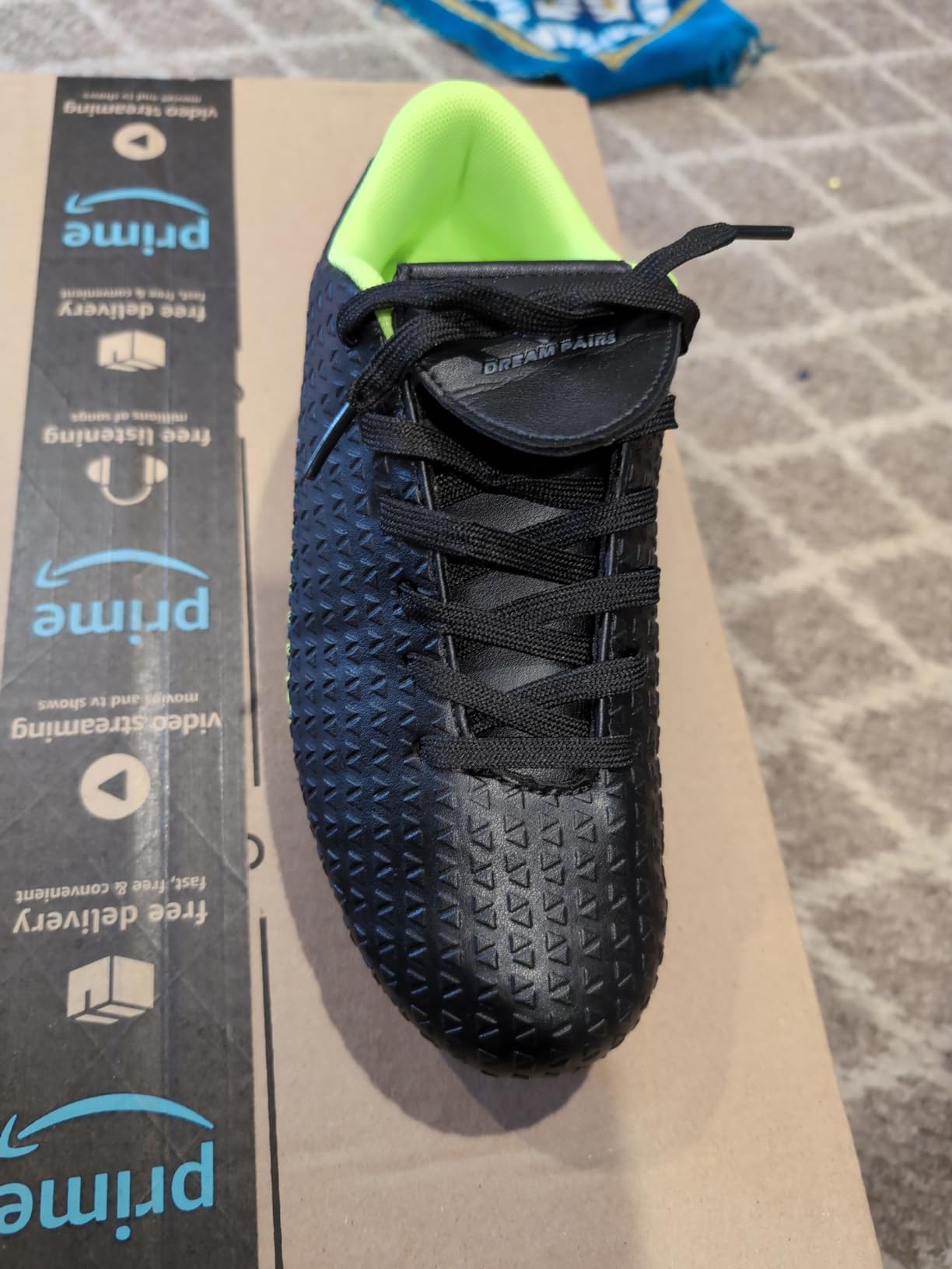 DREAM PAIRS boys girls soccer cleats neon green black colorway showing high ankle design and fold-over tongue protection
