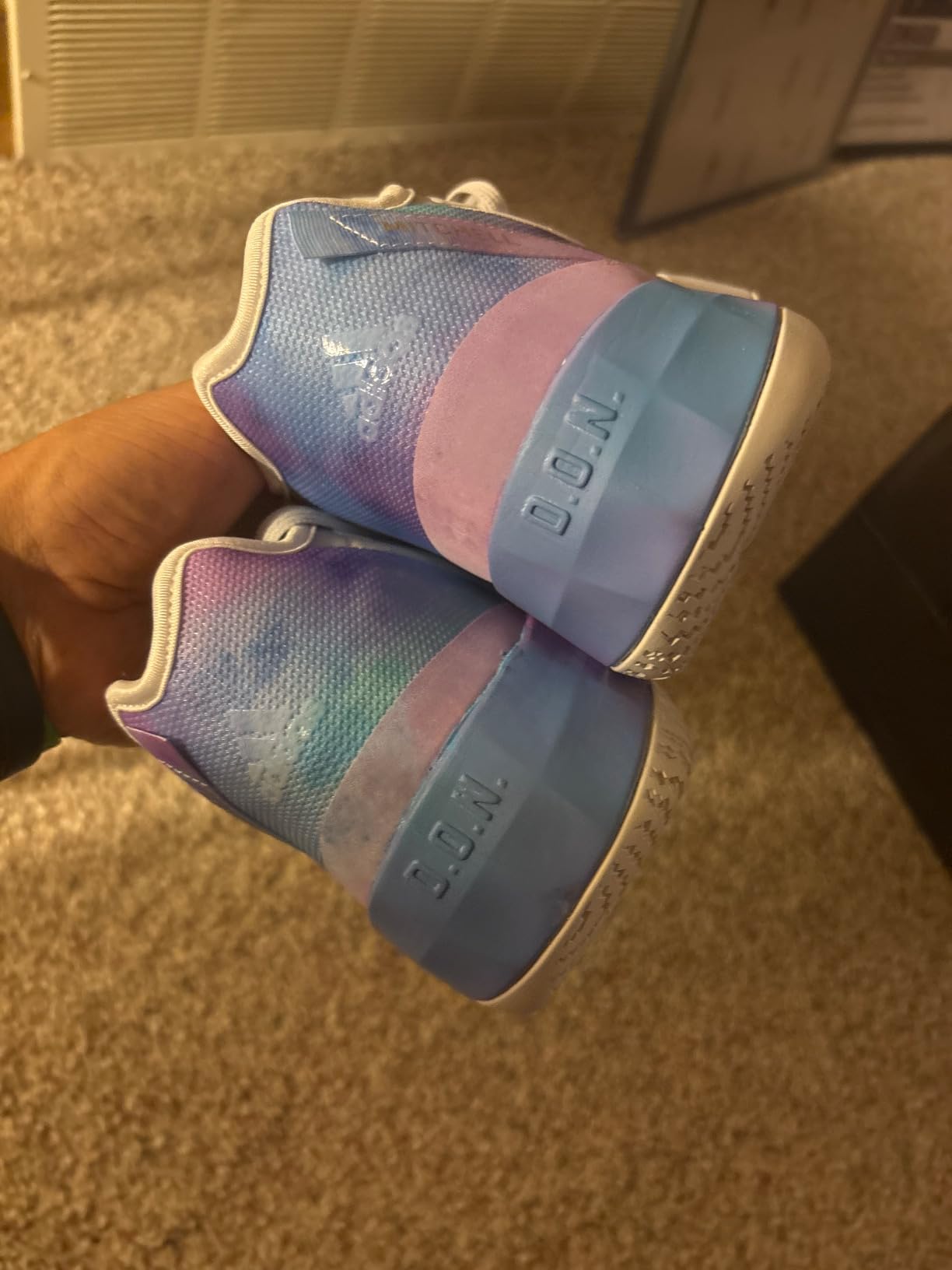 Bottom view showing rubber outsole traction pattern for basketball courts