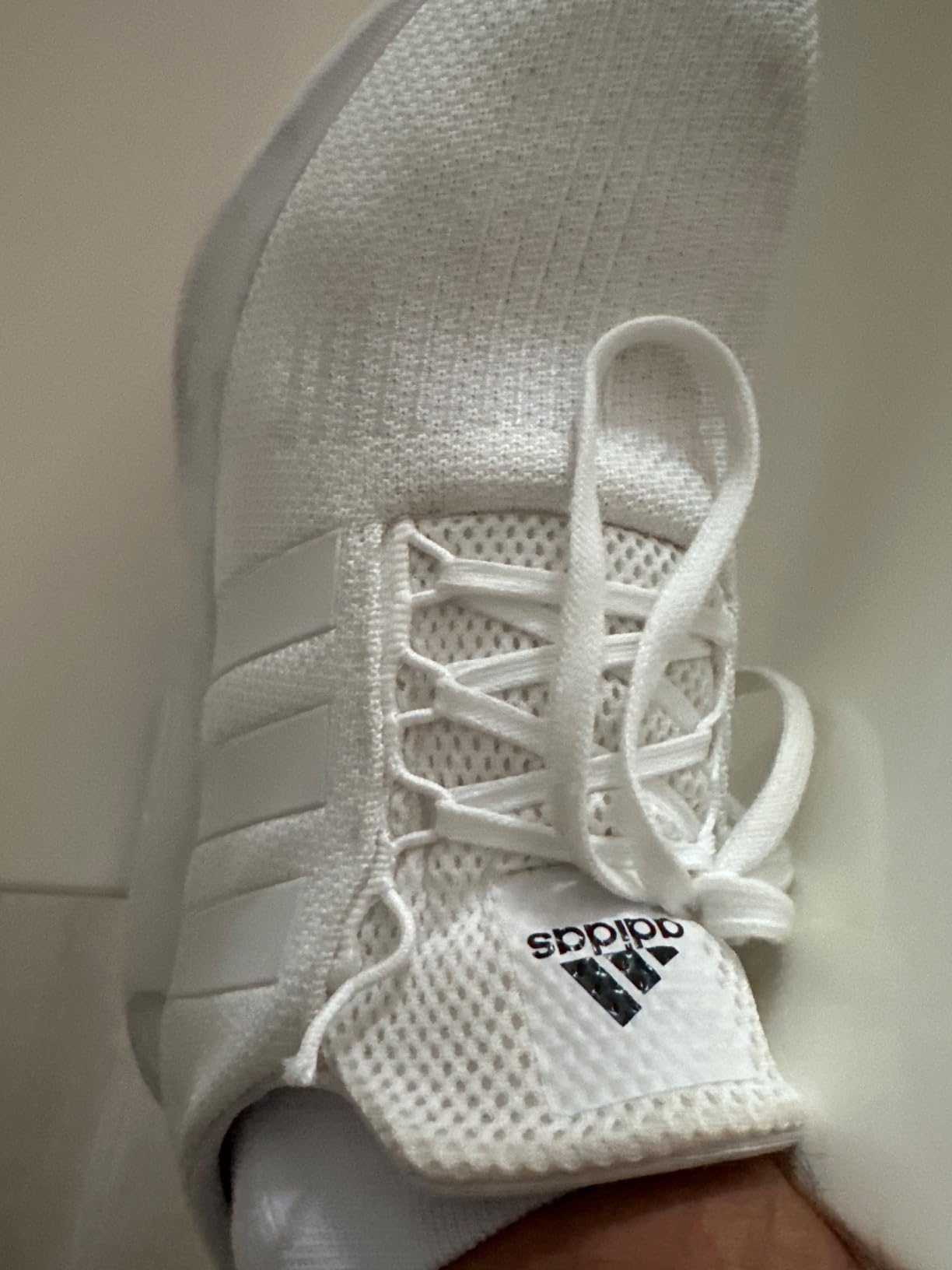 Multiple views of Adidas Swift Run sneaker showing various angles and colorways