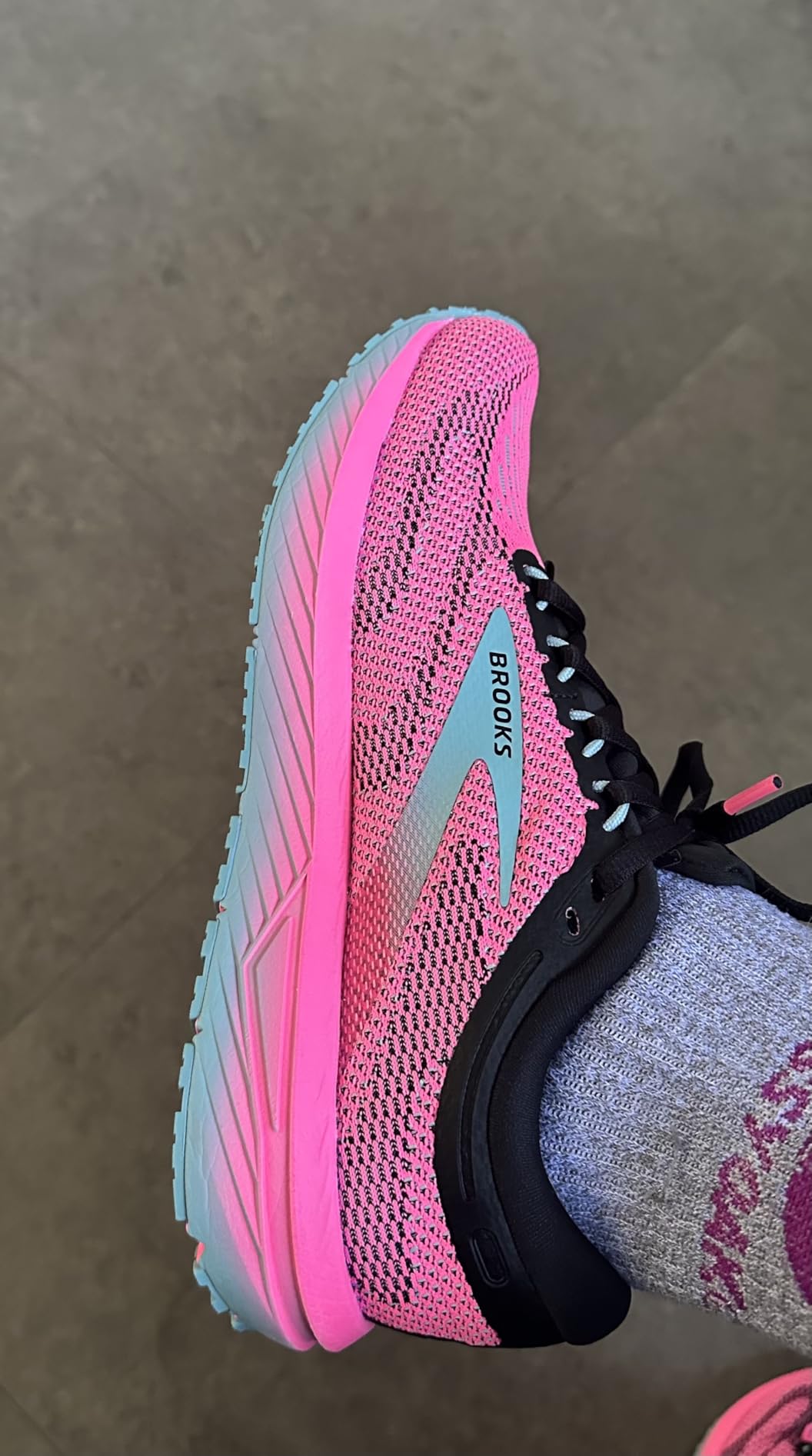 Brooks Revel 7 side profile showing DNA midsole cushioning and rubber outsole design