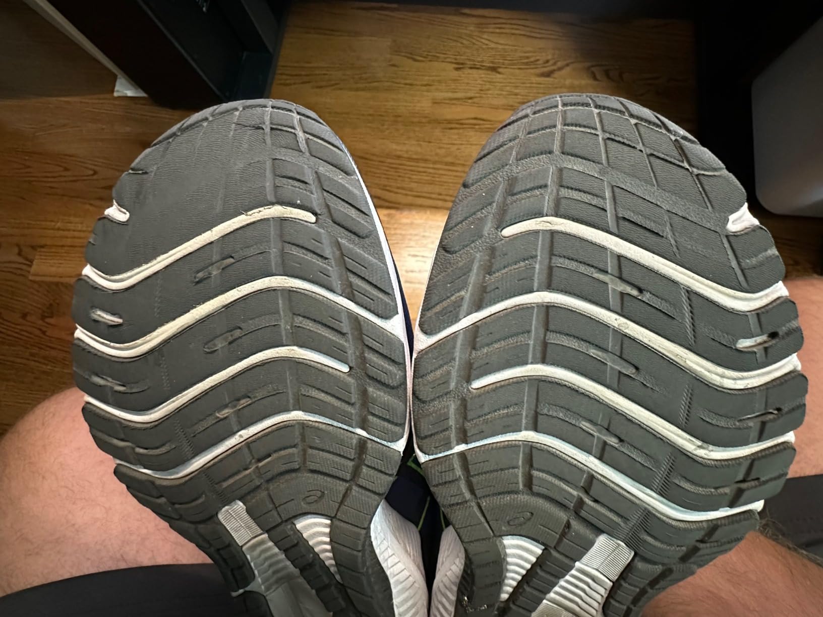 ASICS GT-1000 12 showing detailed view of outsole wear after extensive testing