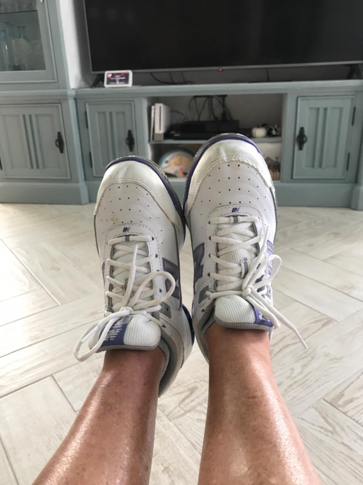 New Balance Women's 806 tennis shoe on court surface showing traction pattern