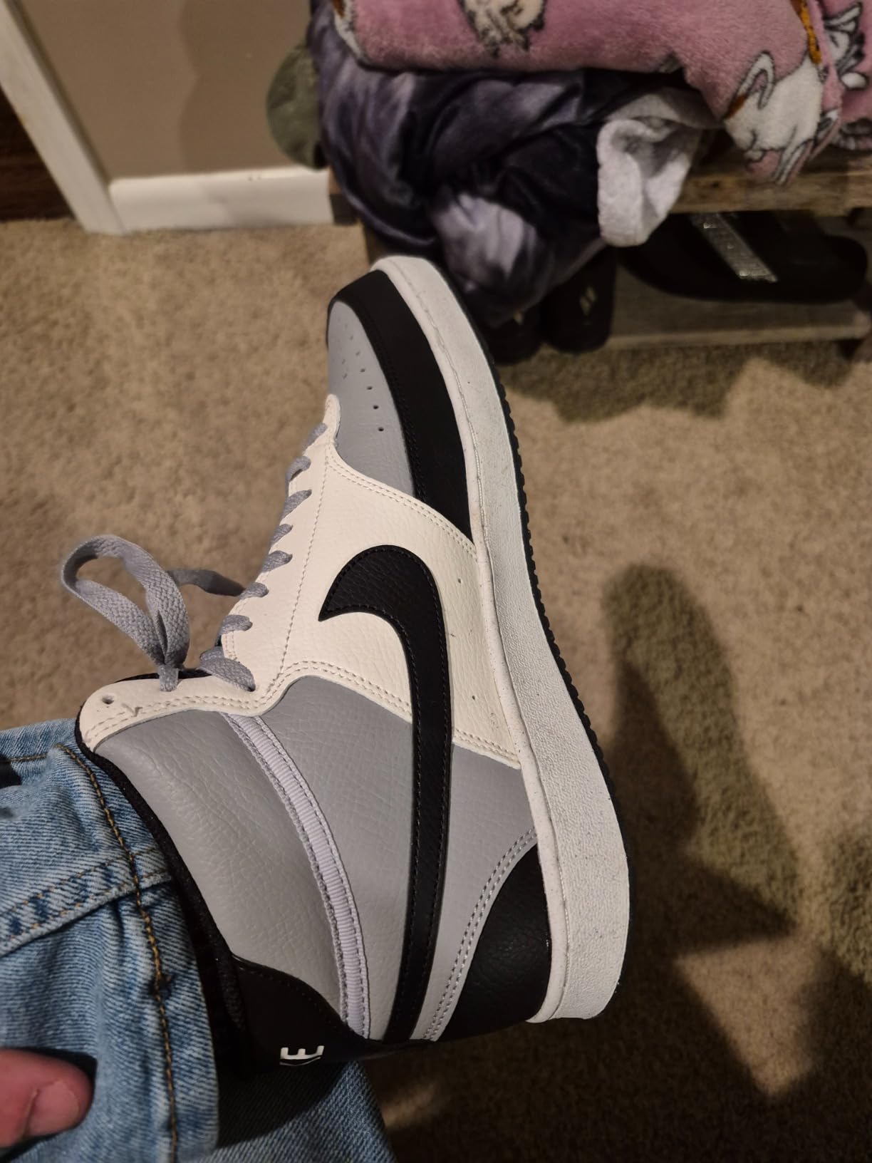 Nike Court Vision Mid showing toe box perforations and lacing system detail