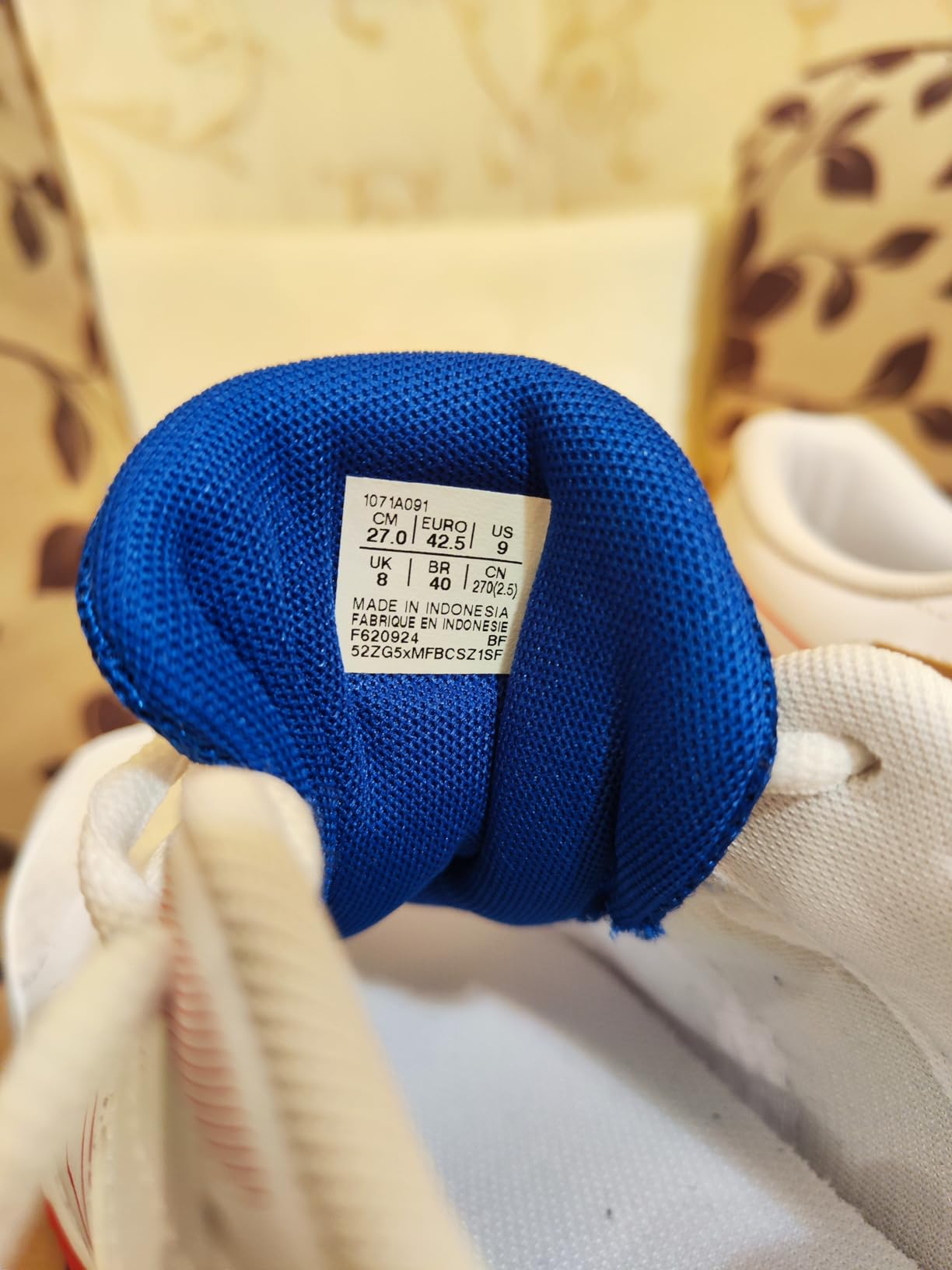 Asics Gel-Rocket 11 profile view highlighting ankle support and heel cushioning technology