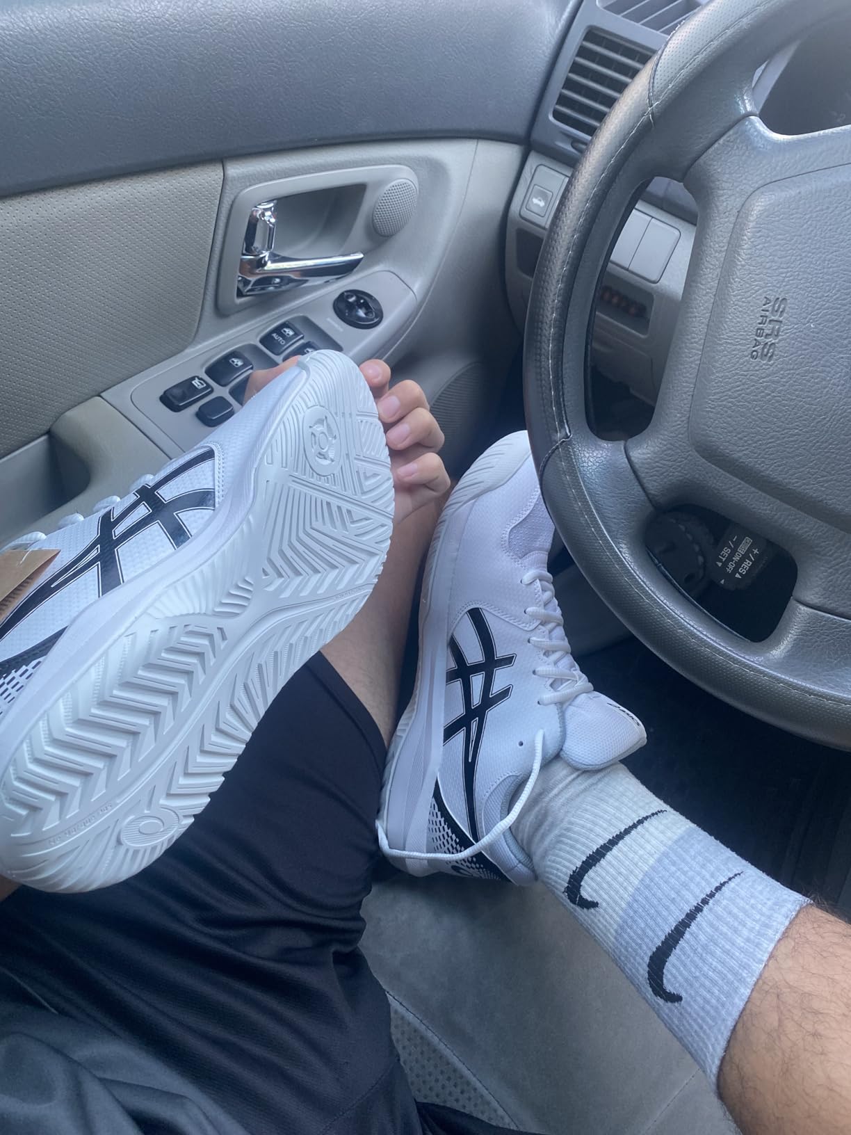 ASICS Gel-Dedicate 8 side view showing synthetic leather toe overlays and TRUSSTIC technology