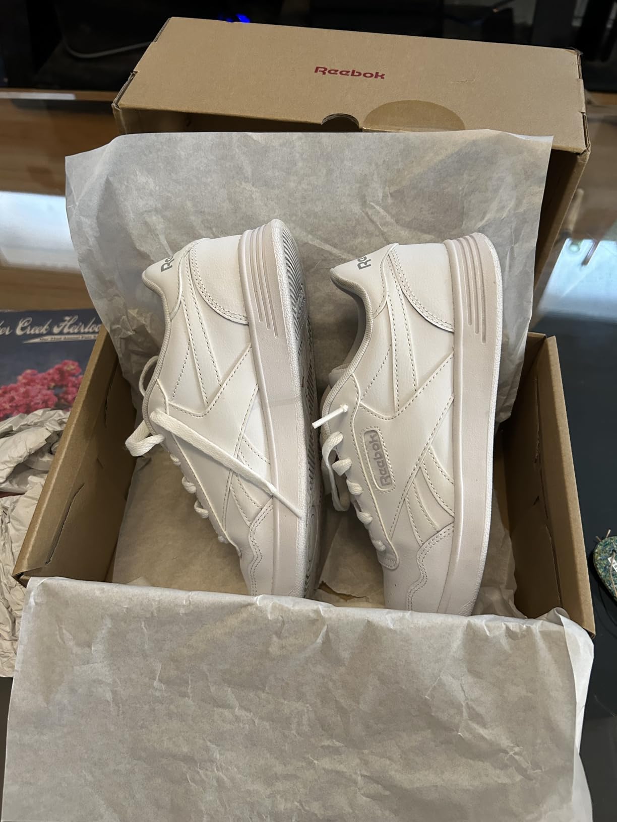 Reebok Court Advance interior view showing OrthoLite sockliner and padded collar details