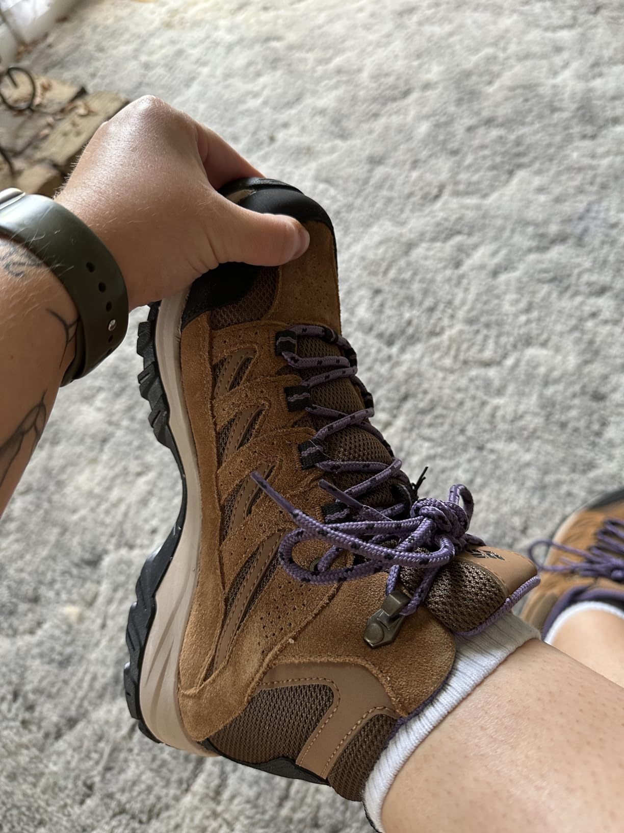 Proper hiking boot fit demonstration showing thumb space at toe for Columbia Crestwood sizing