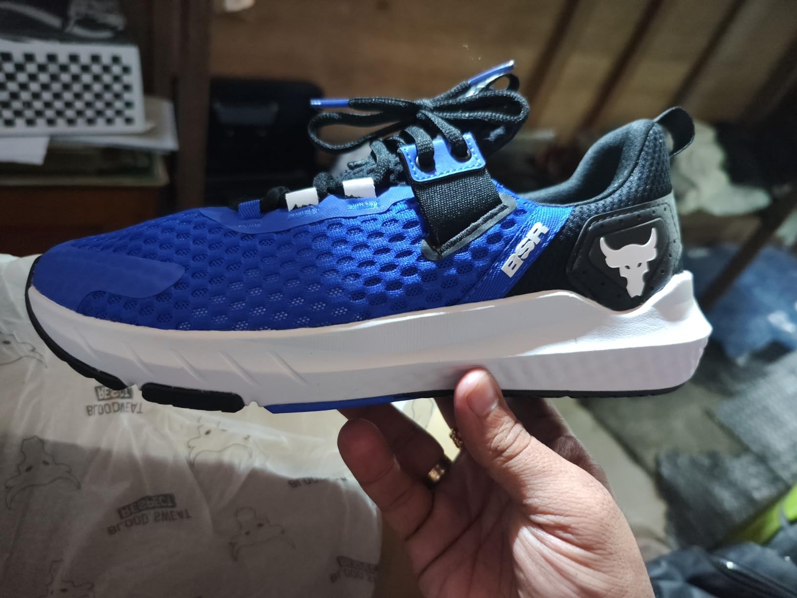 Side profile view of Project Rock BSR 4 showing the bootie design and heel support structure