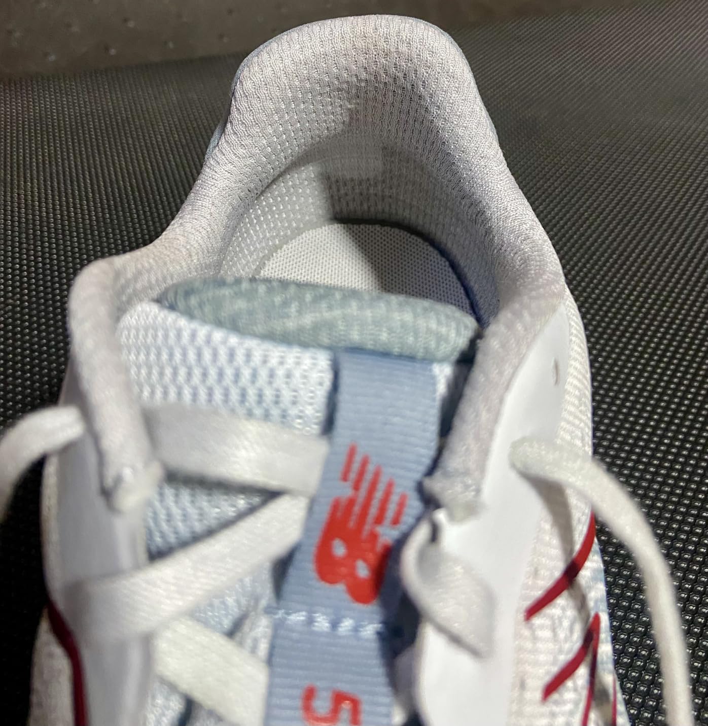 New Balance 520 V8 showing engineered mesh upper construction and no-sew overlays detail