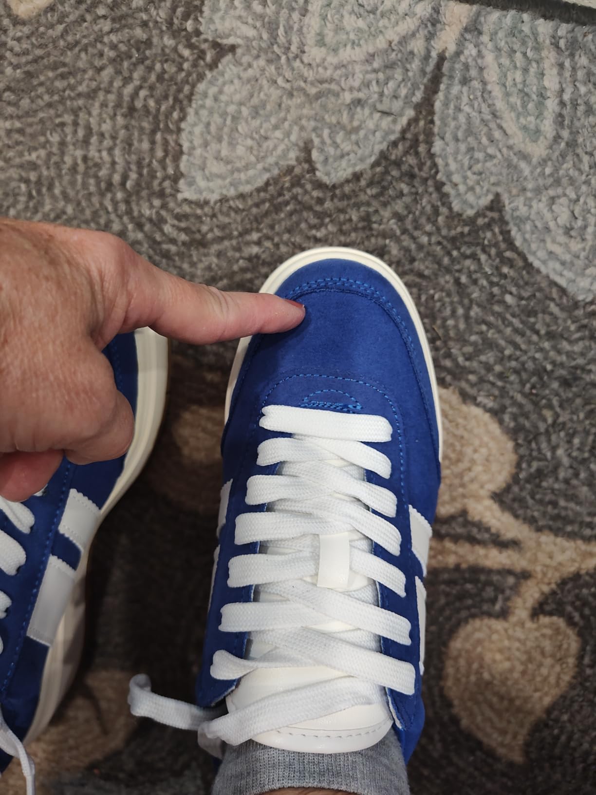 Side profile view of Madden Girl Navida sneaker showing platform height and overall silhouette