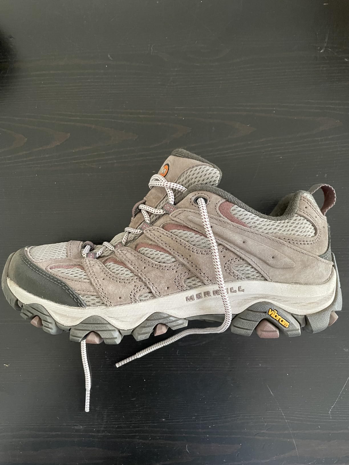 Close-up detail of Merrell Moab 3 construction showing Vibram sole and protective toe cap