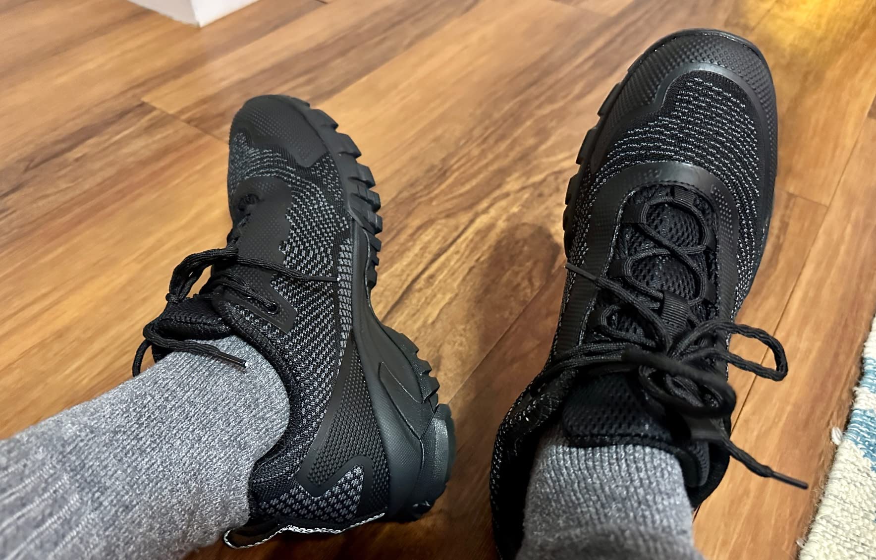 Close-up of ULOGU hiking shoe construction showing synthetic upper and lacing system