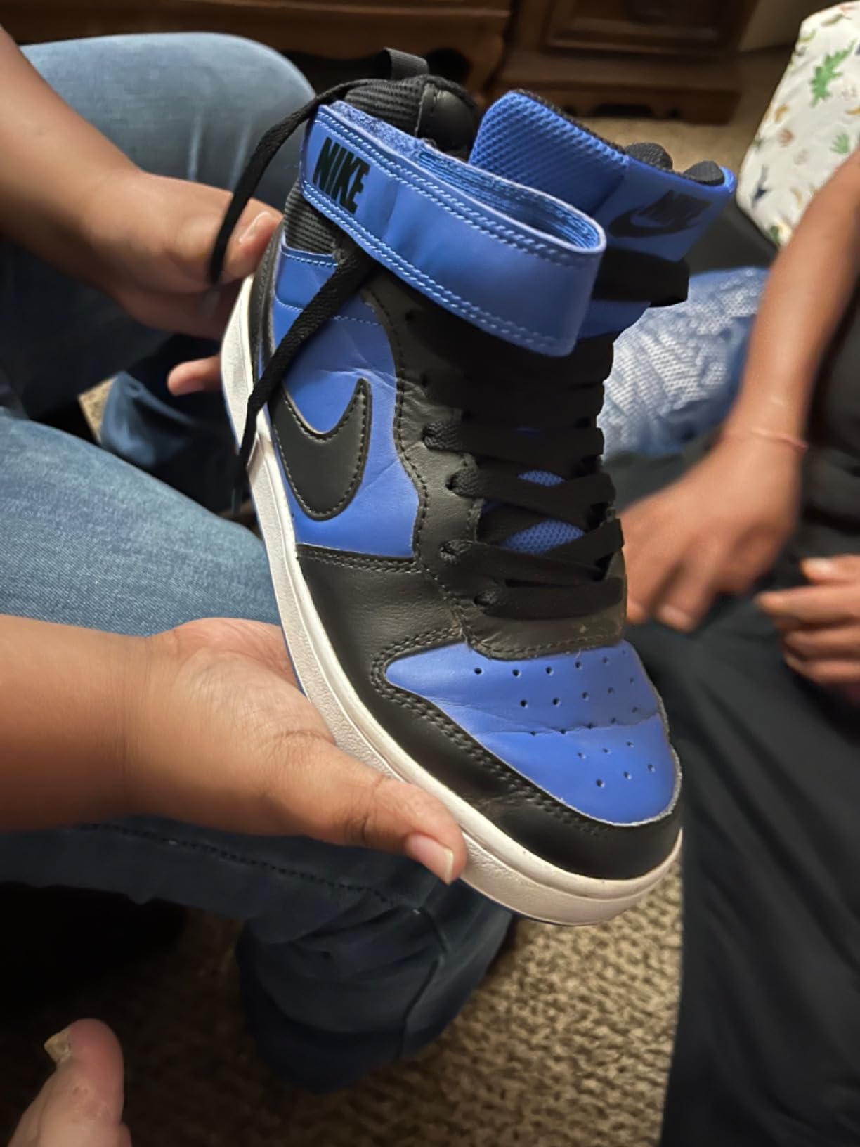 Customer satisfaction photo showing UpUGo laces successfully improving appearance of older sneakers