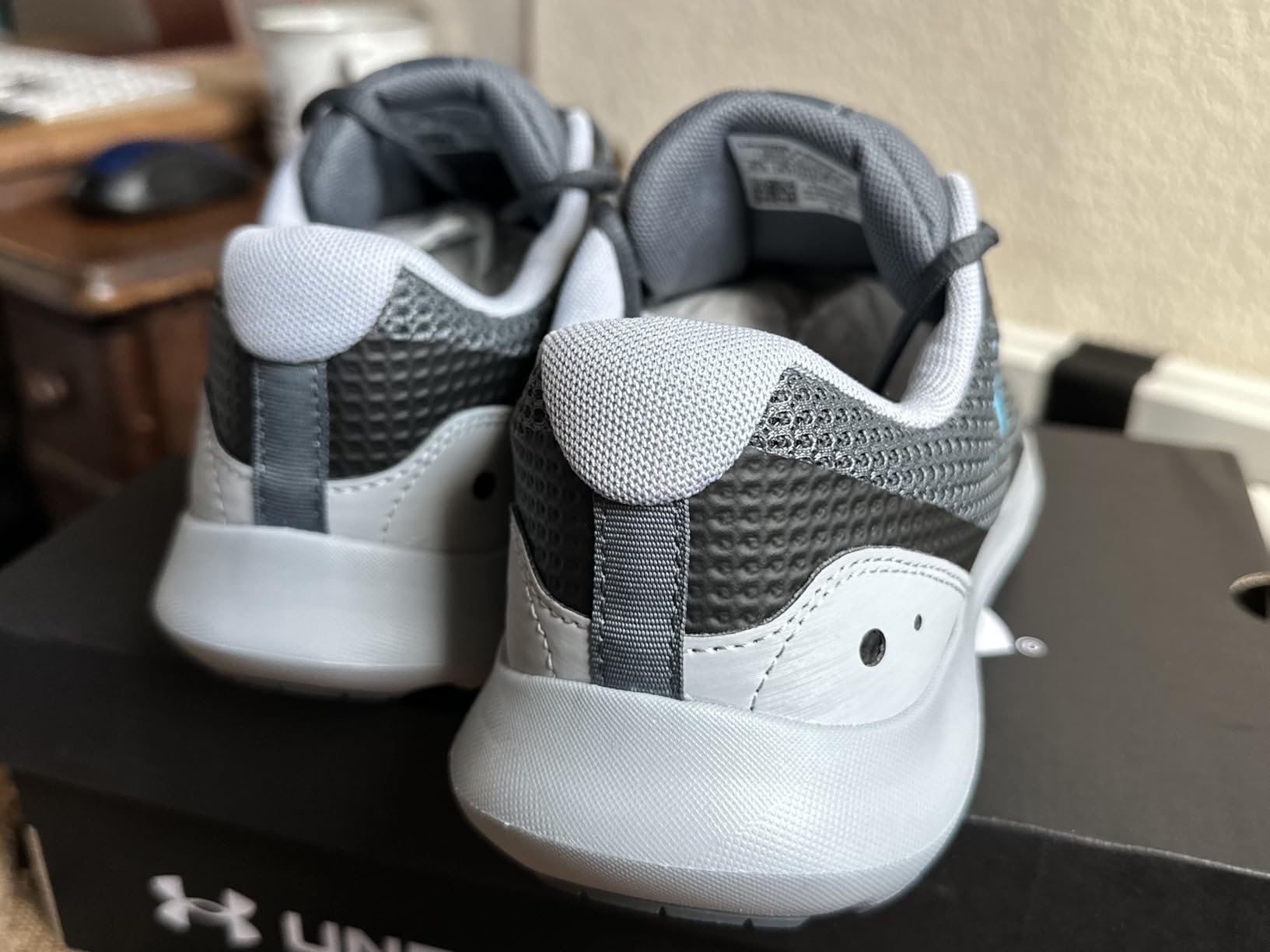 Under Armour Surge 3 detailed view of mesh upper and lacing system construction