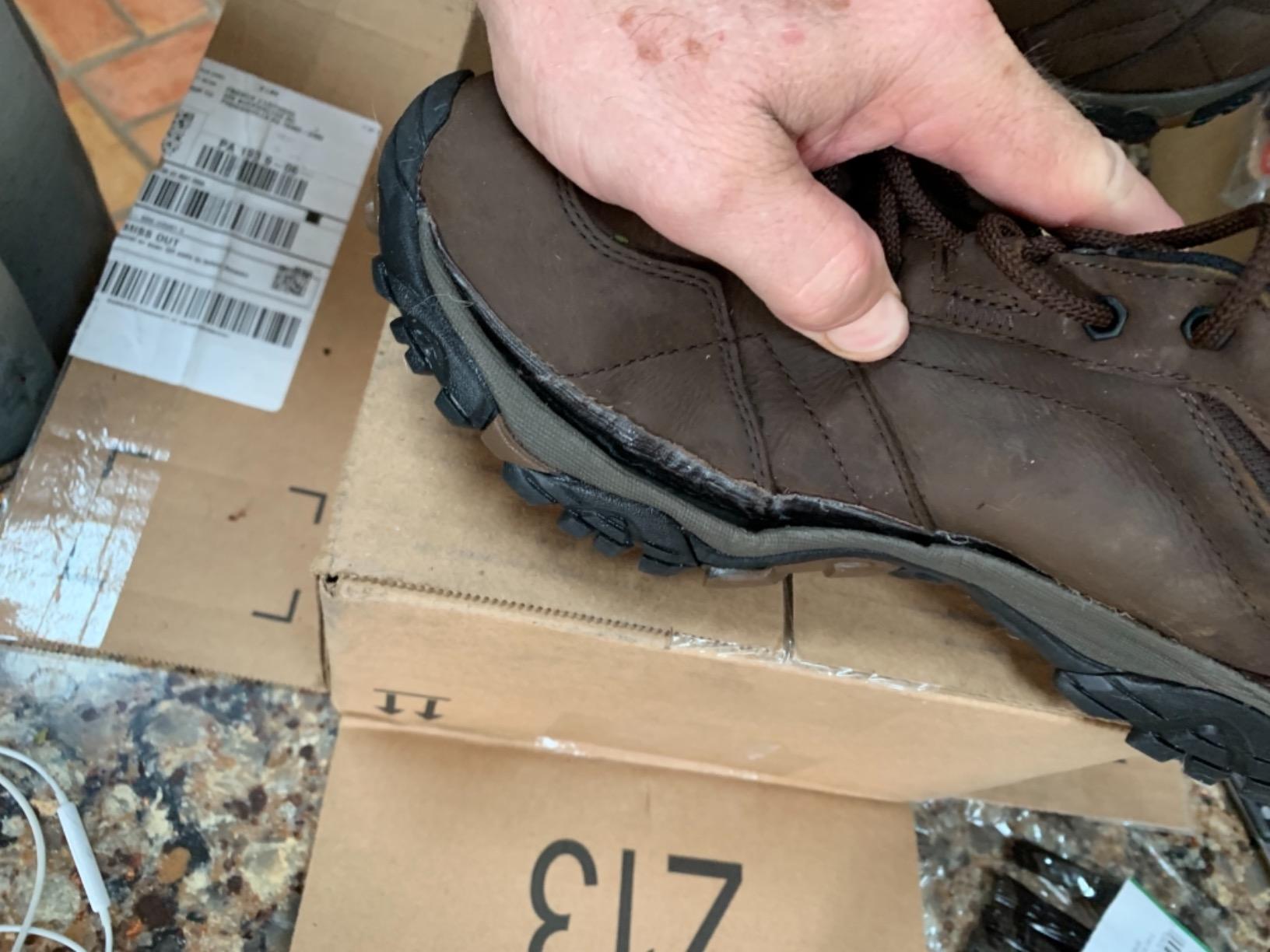 Water damage on Merrell Moab Adventure Lace after rain exposure showing construction issues