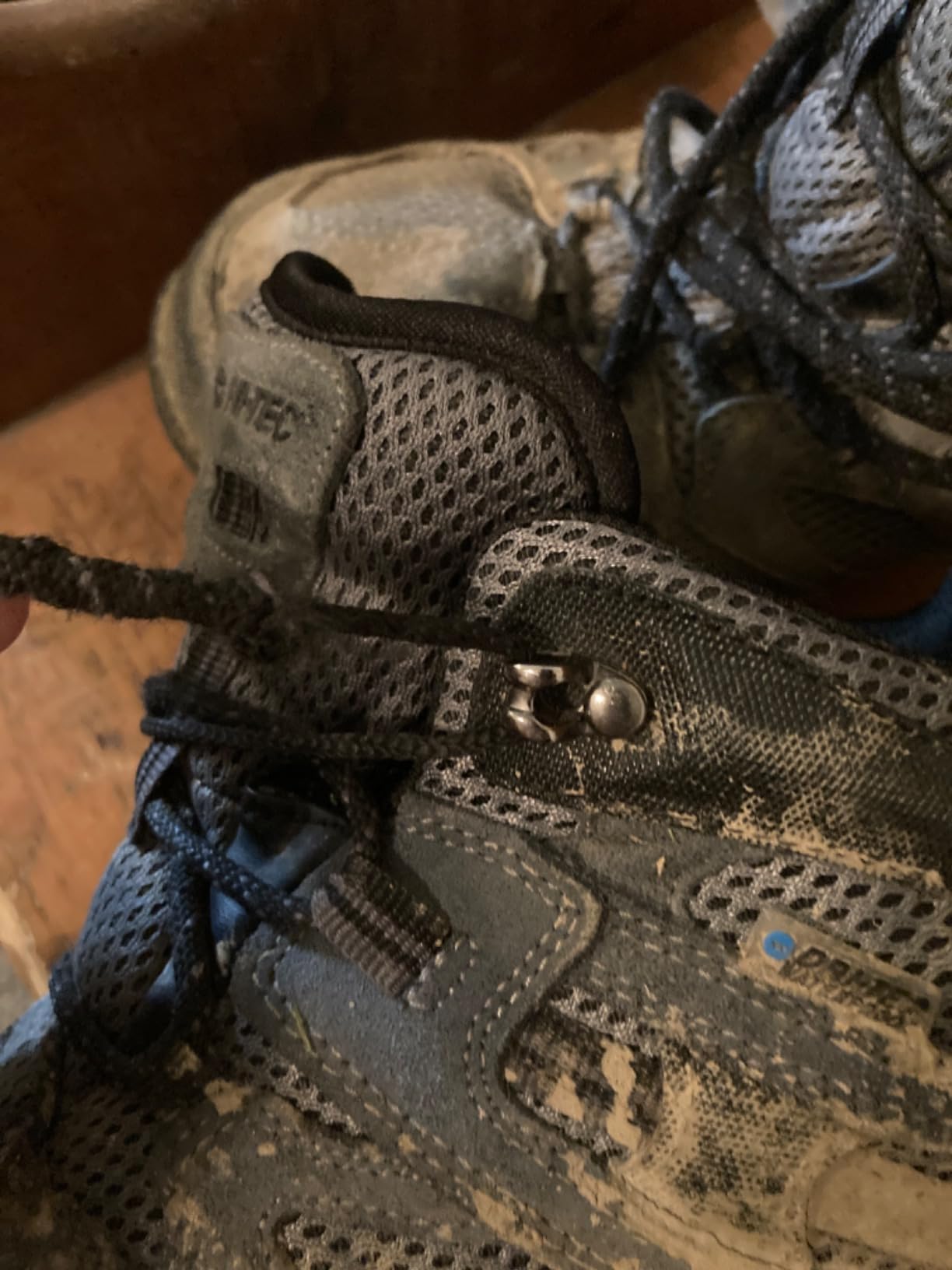 Close-up of metal lacing eyelets showing design flaw that can cause lace wear