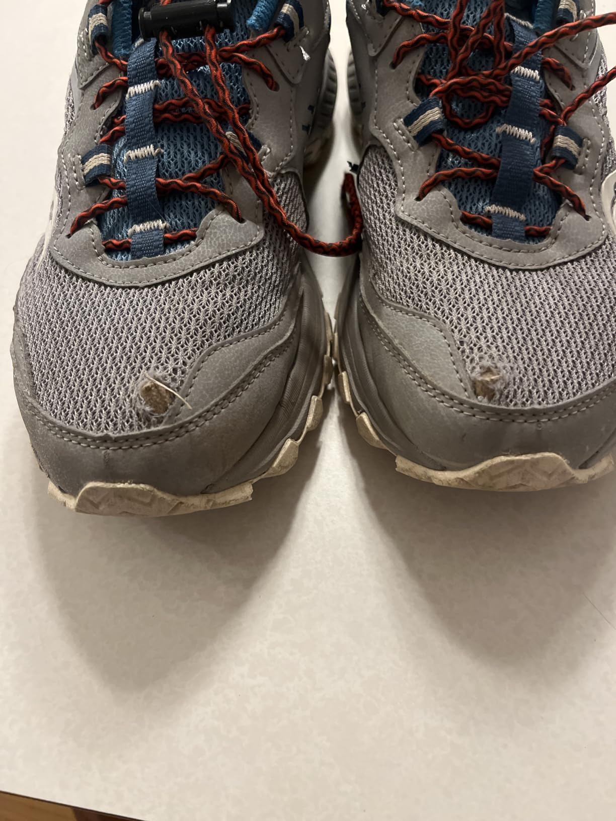 Close-up view of Saucony Excursion TR15 mesh upper showing protective overlays and lacing system design