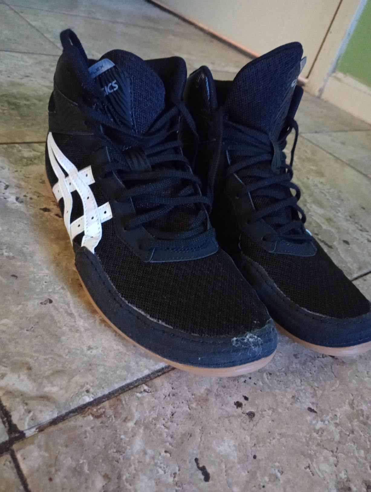 Close-up view of ASICS Matflex 7 lacing system and ankle-high design for wrestling support