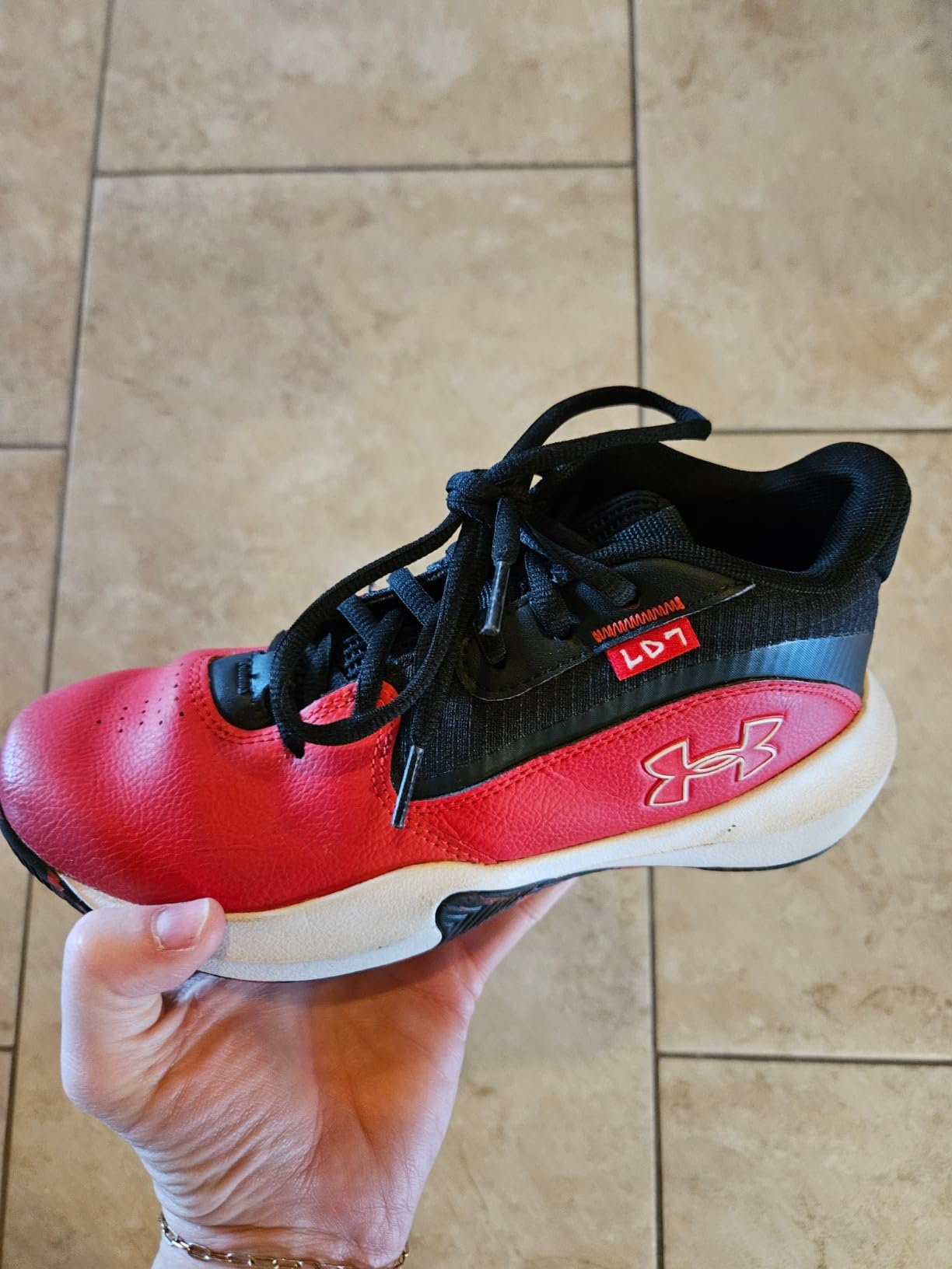 Under Armour Lockdown 7 basketball shoes worn by young athlete showing real-world fit and performance