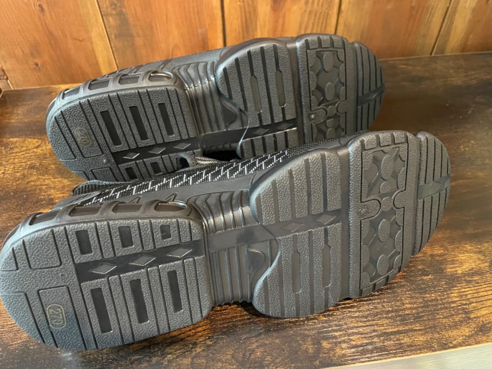Construction worker wearing steel toe shoes on job site showing real-world application