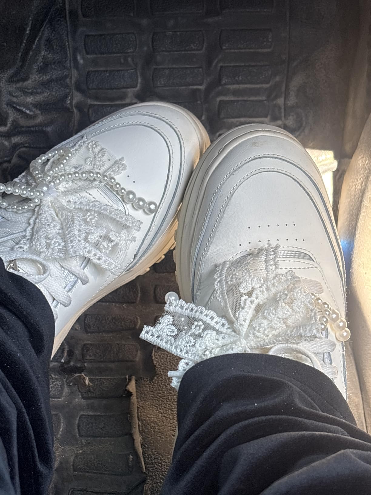 Lifestyle shot of Reebok Club C Extra sneakers paired with casual outfit showing versatility