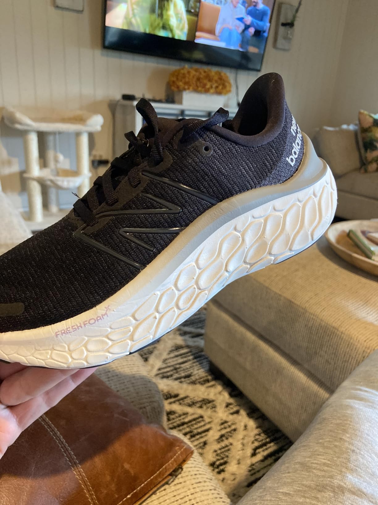 New Balance Women's Fresh Foam X Kaiha Road V1 running shoe in black and gray colorway showing side profile and Fresh Foam X midsole