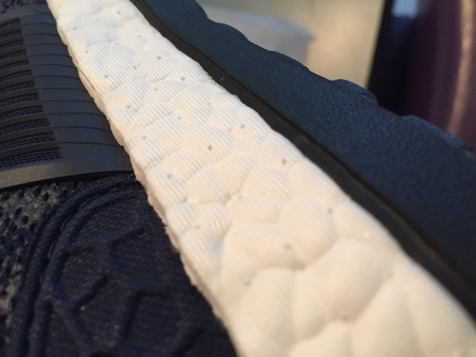Close-up of Adidas Pureboost ZG mesh upper construction and lacing system