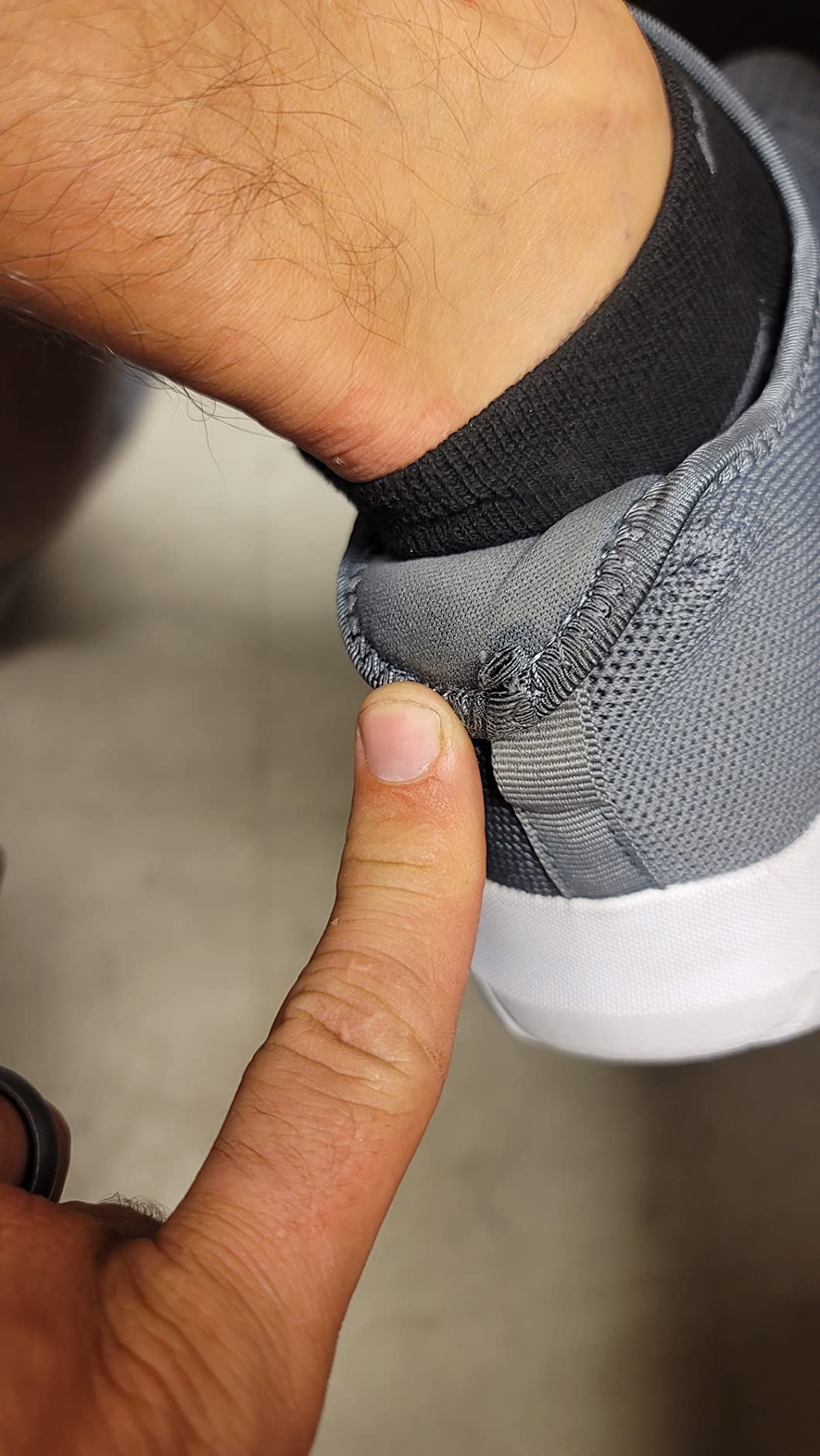 Close-up detail of WXQ walking shoe showing 3D knit mesh upper texture and slip-on construction