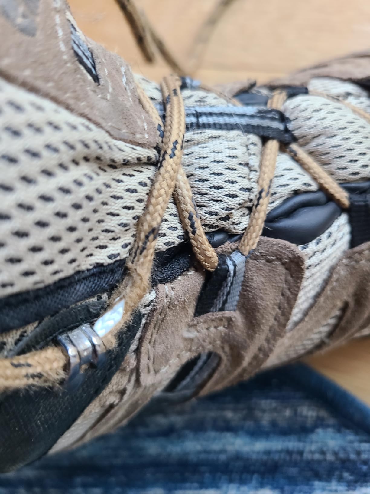 Comparison showing multiple pairs of HI-TEC Ravus WP boots demonstrating sizing and wear patterns