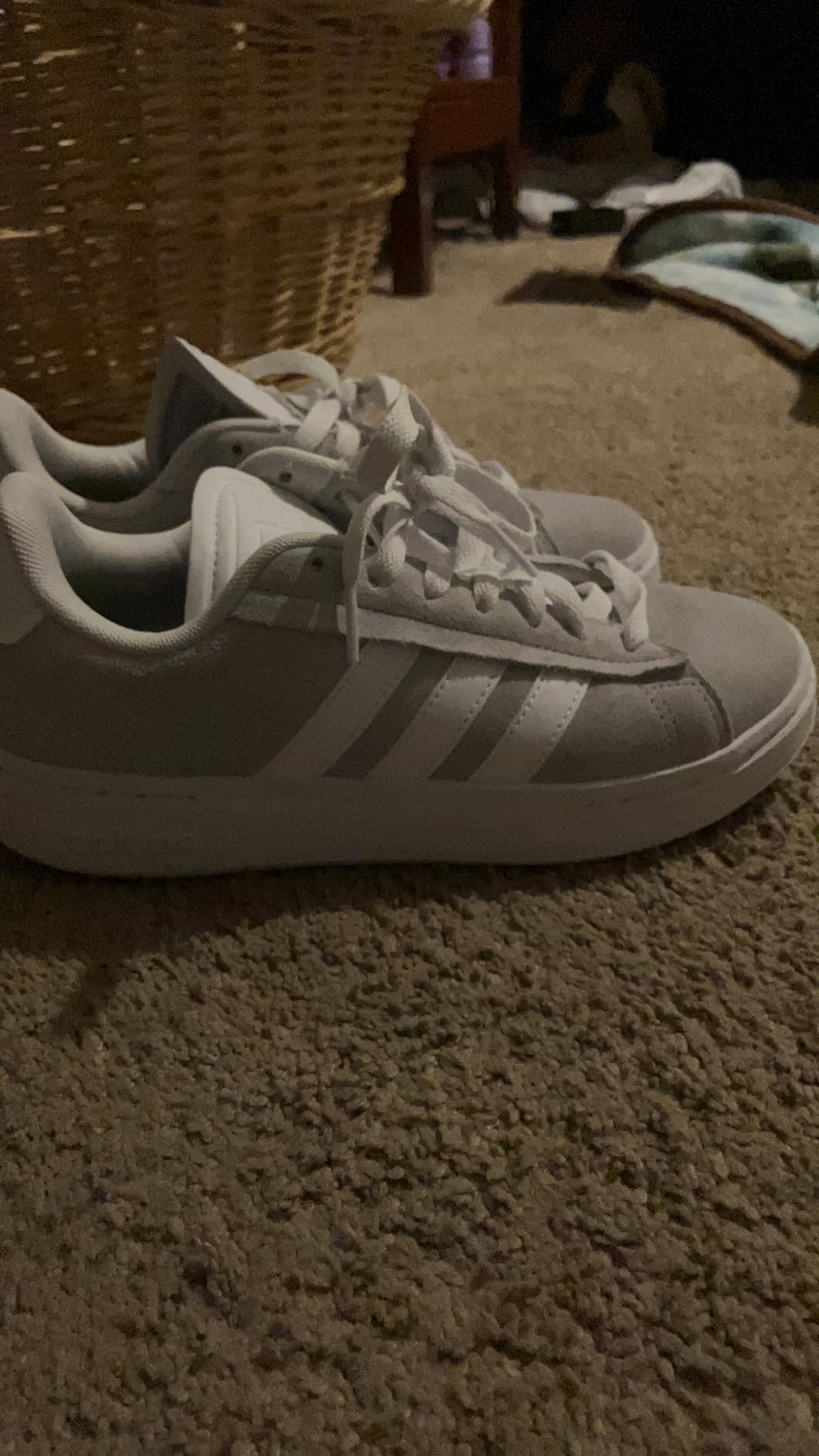 Adidas Grand Court Alpha detail shot showing three stripes design and synthetic leather upper