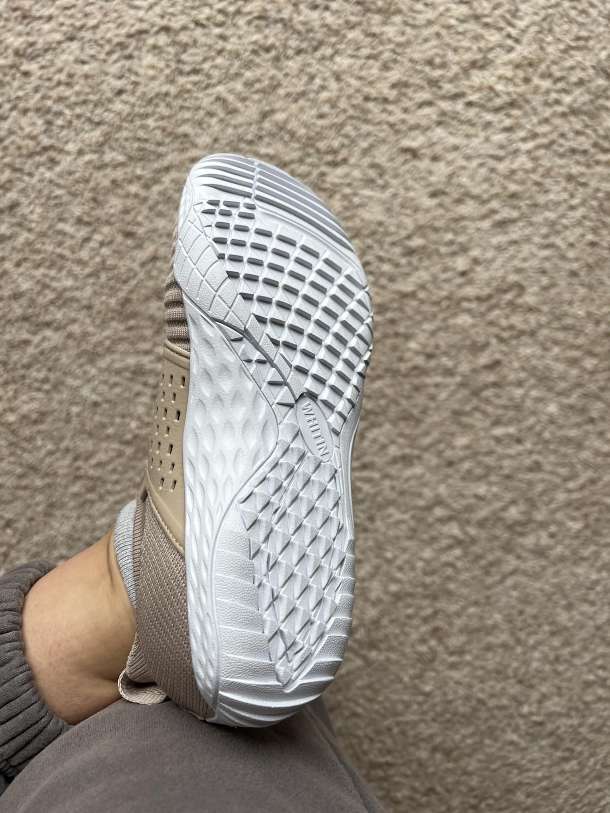 WHITIN barefoot shoes being worn outdoors showing flexibility and ground contact