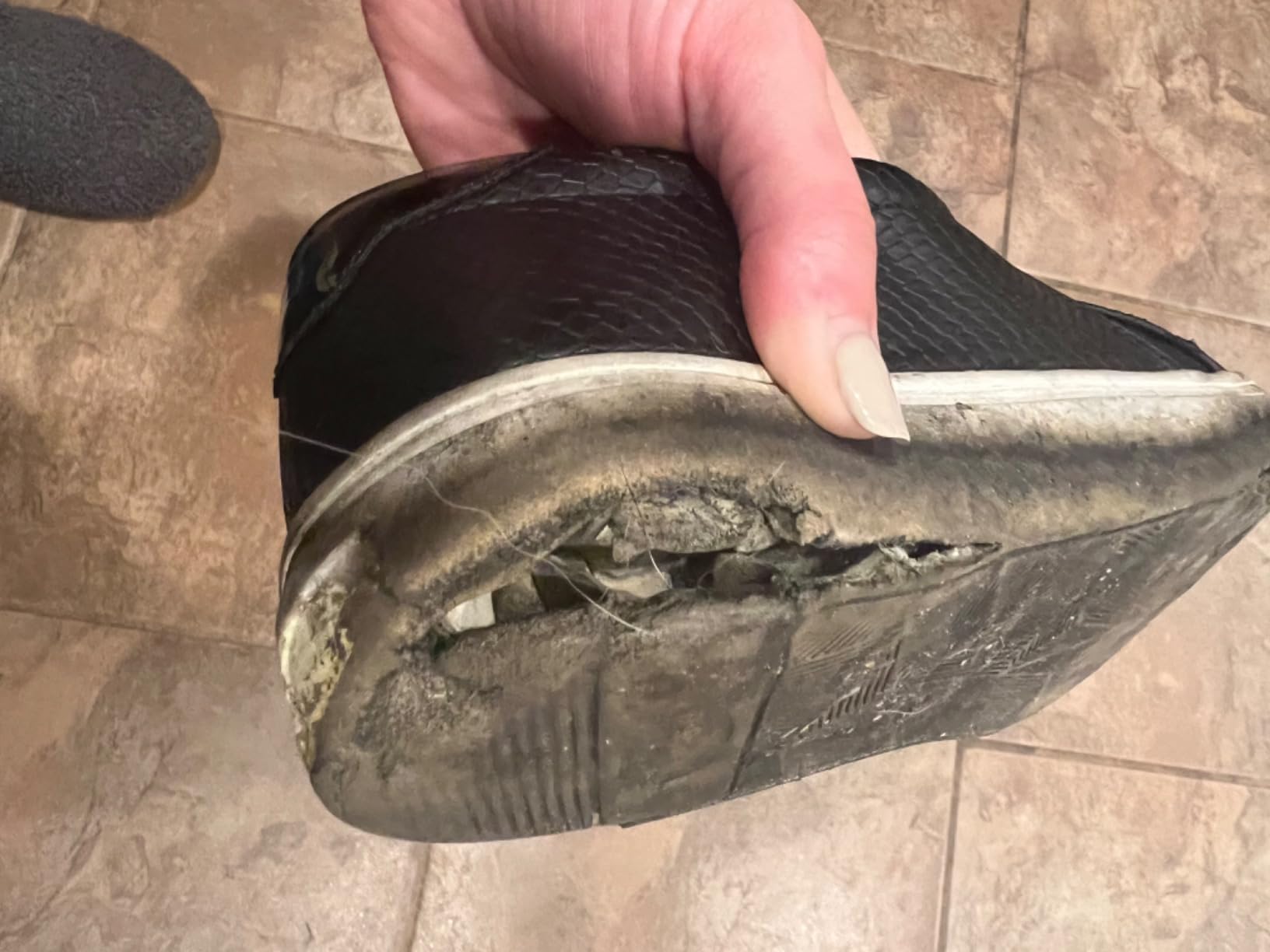 Dr. Scholl's Nova showing sole detachment and wear damage after 4 months of regular use