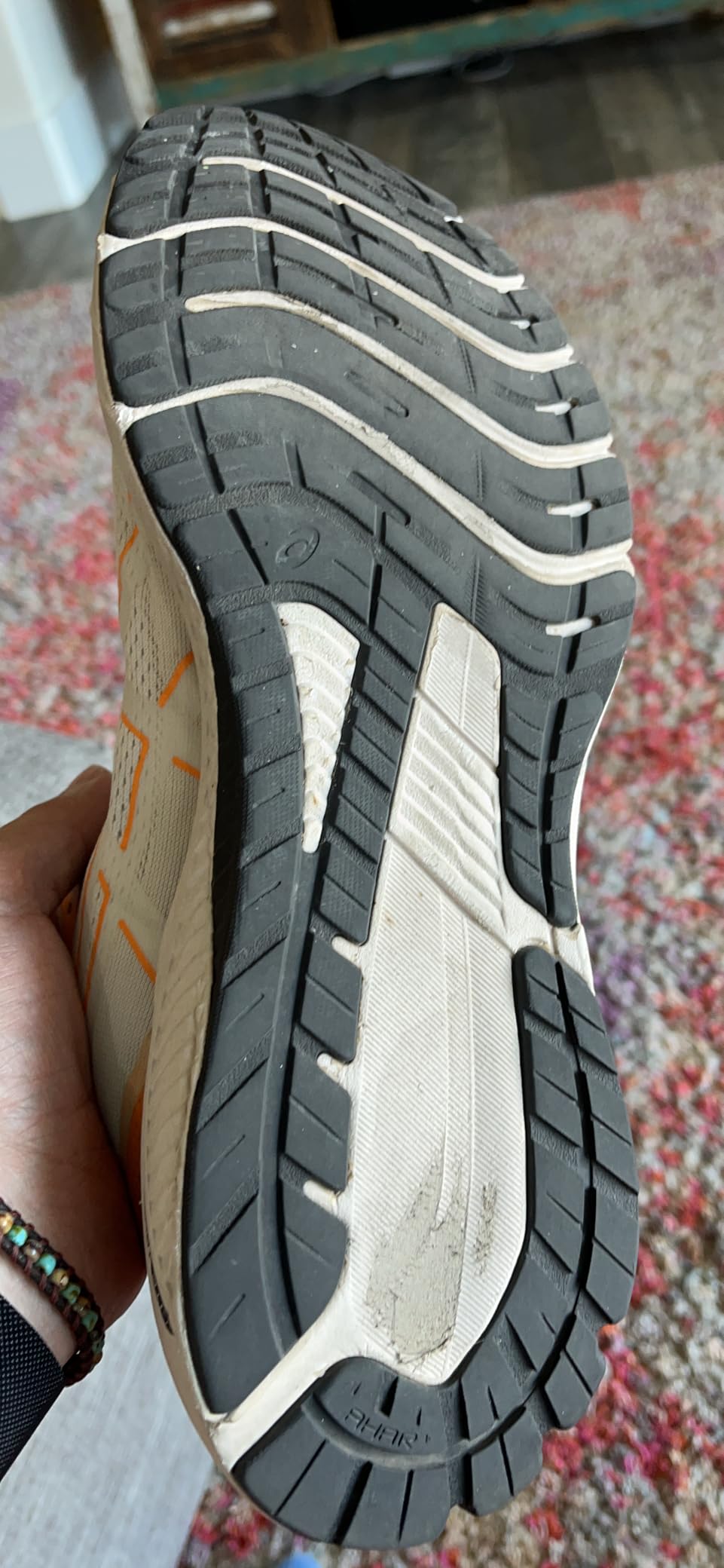 ASICS GT-1000 12 showing sole wear pattern and potential durability concerns