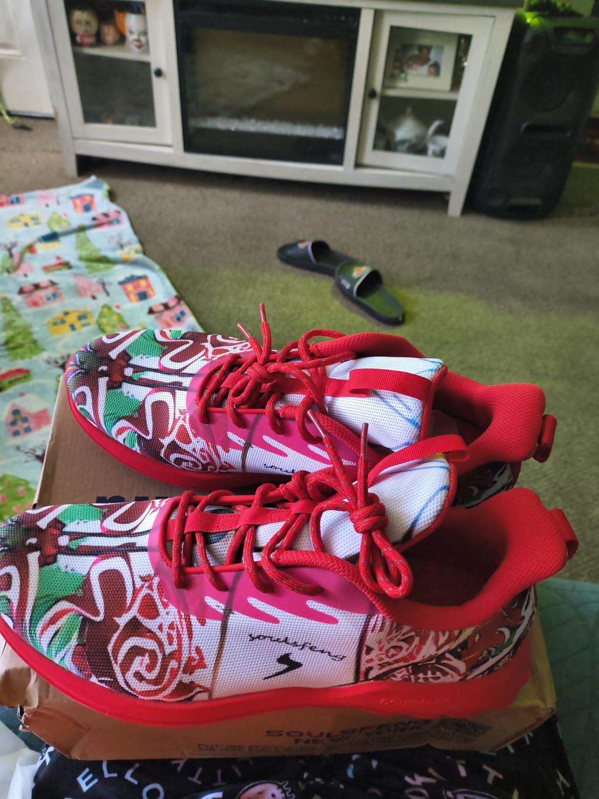 Side view of Soulsfeng sneakers showing mesh upper construction and artistic colorway details
