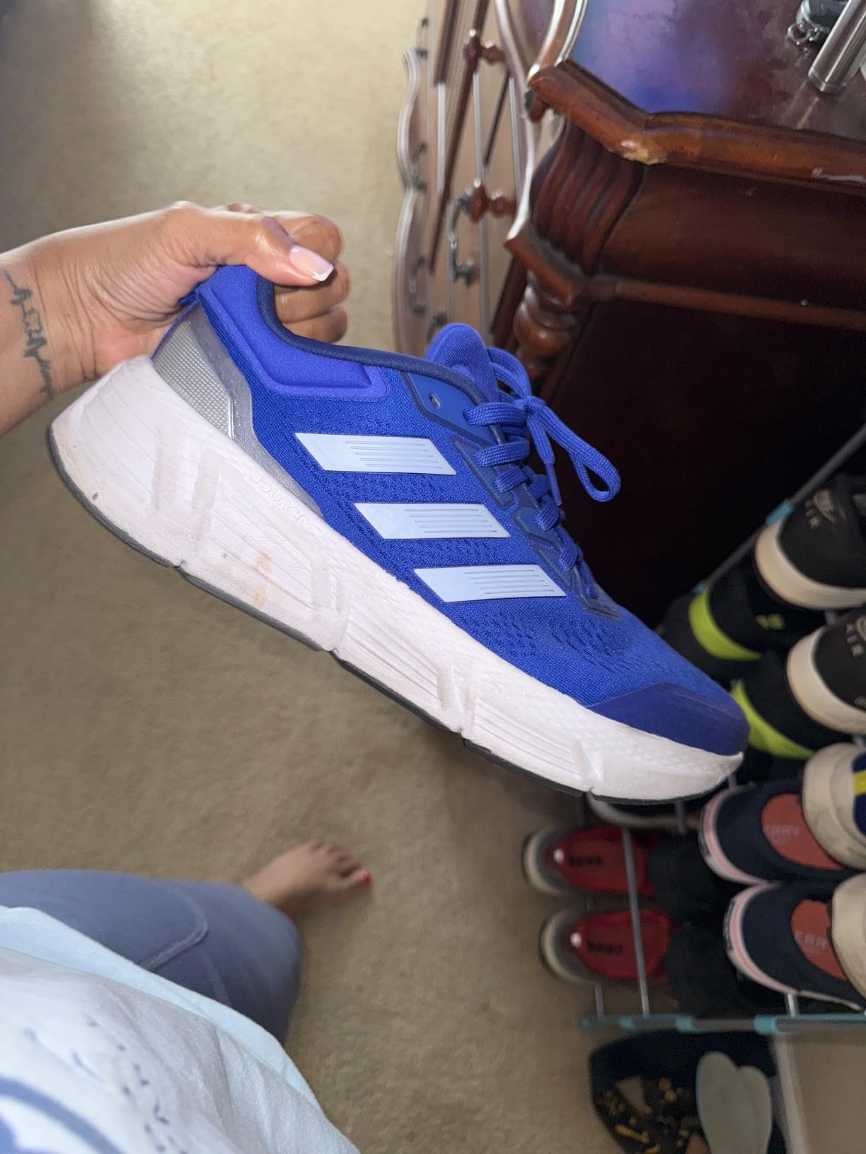 Multiple Adidas Questar colorways showing variety of available options