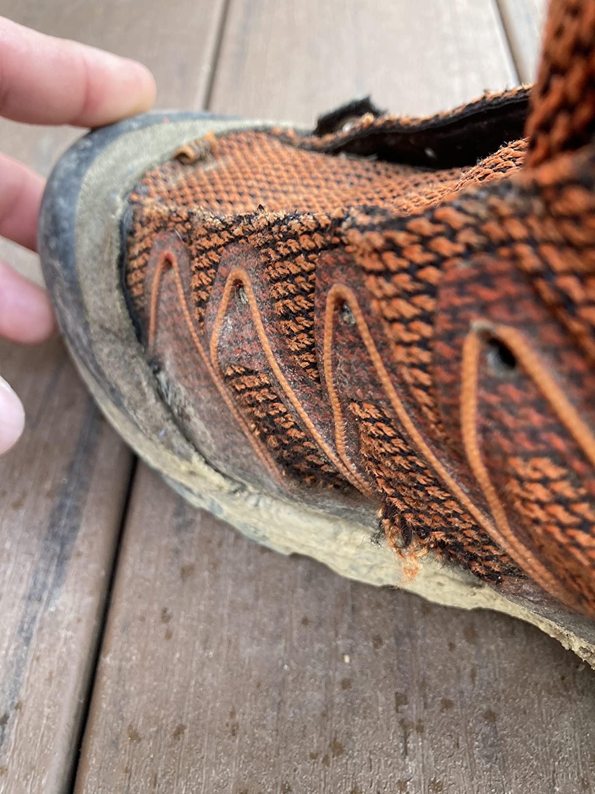 Hiking boot showing premature wear and stitching failure after short-term use