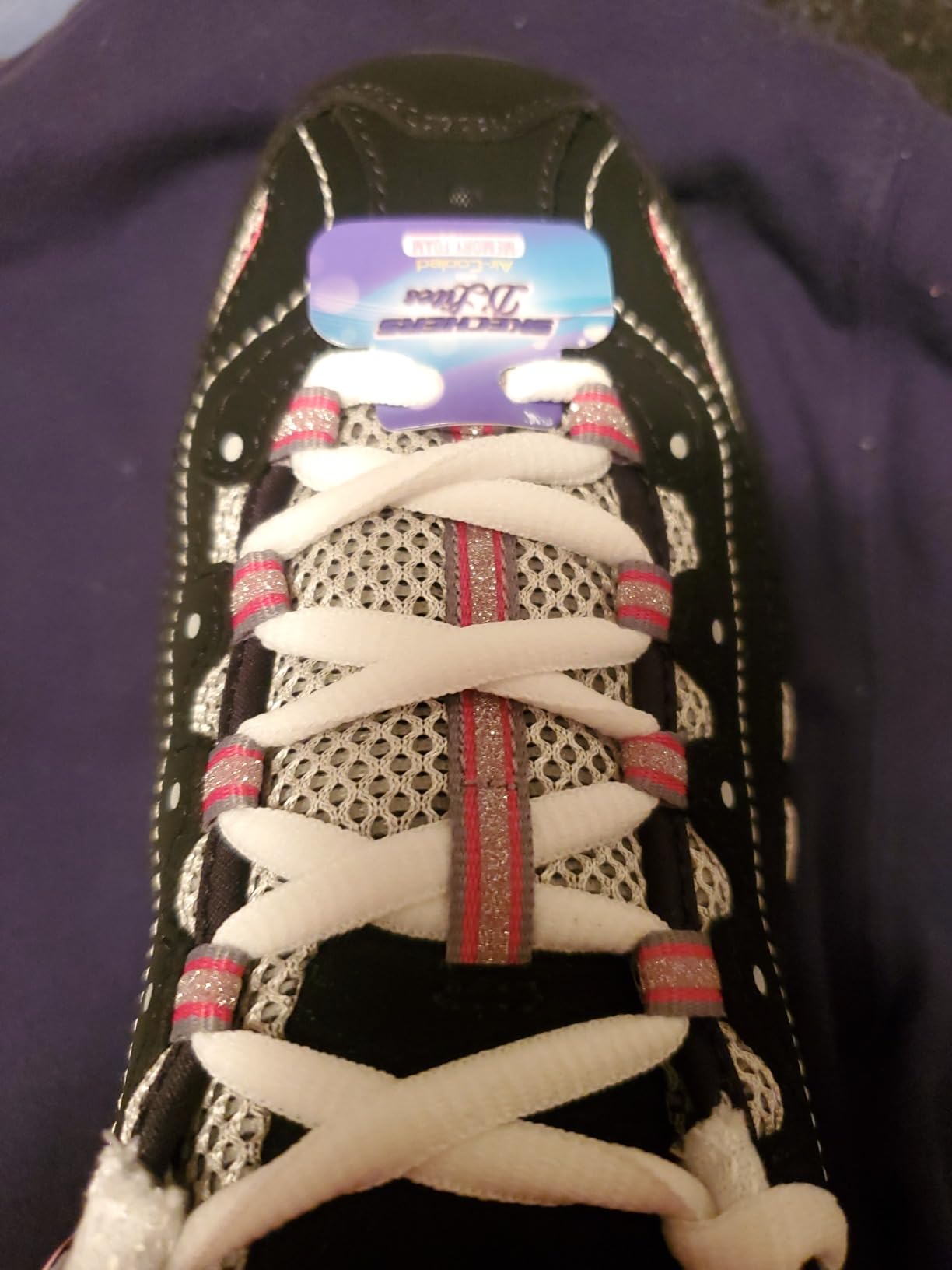 A close-up of the thick, chunky rubber outsole of the Skechers D'Lites, highlighting its tread pattern.