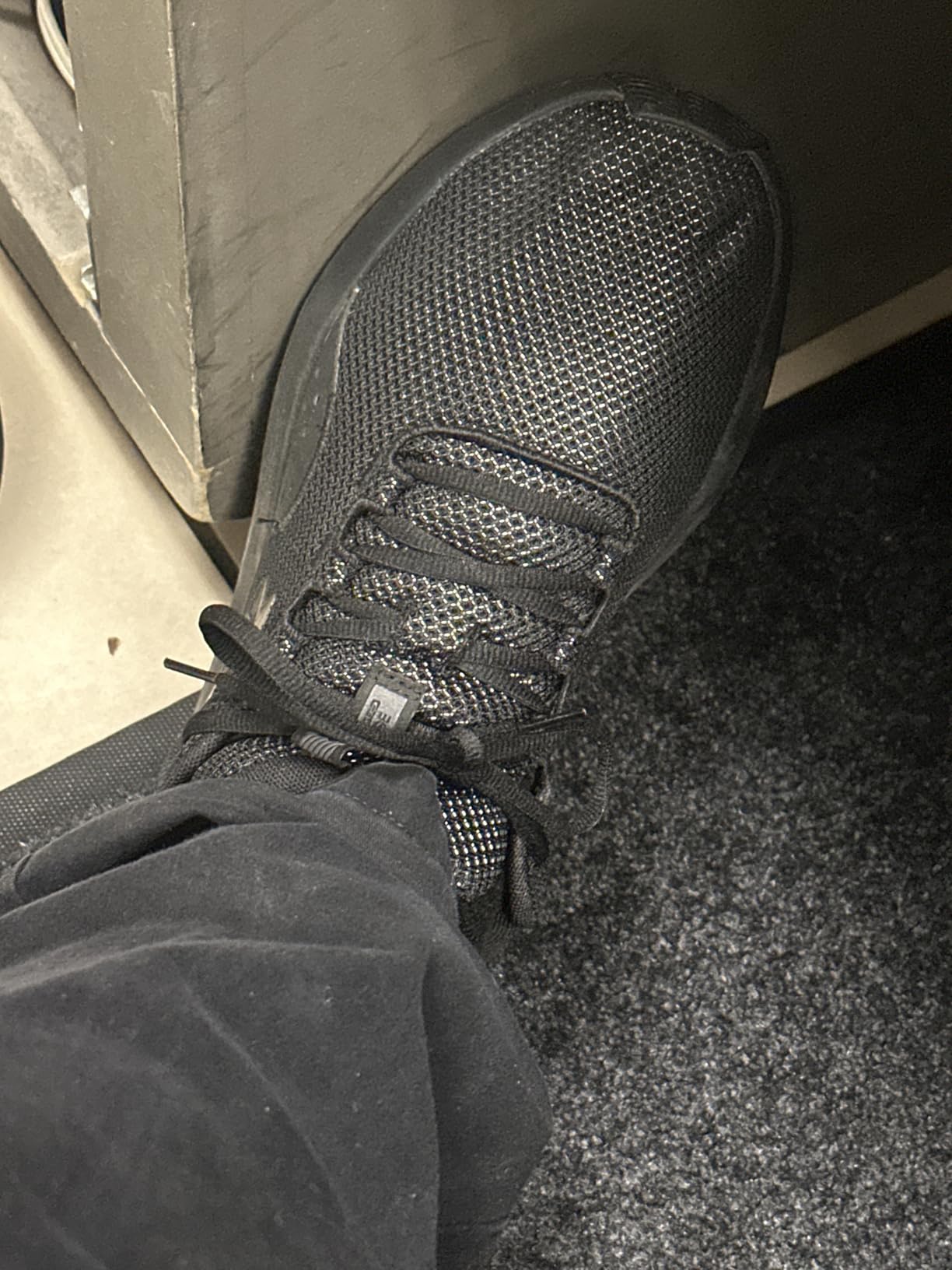 Under Armour Charged Surge 4 showing brand logo and construction quality details