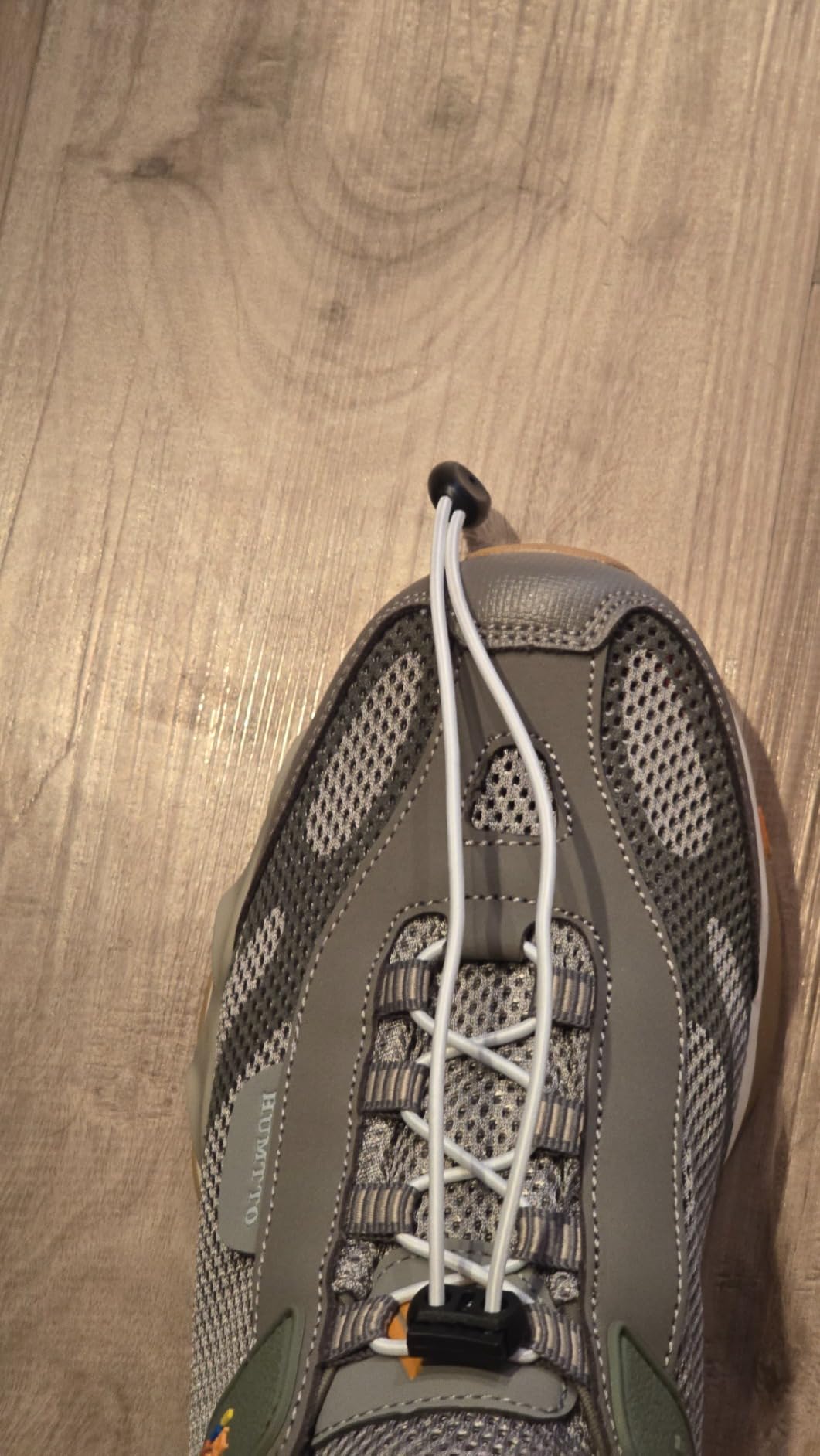 HUMTTO water shoes in action during river crossing showing grip on wet rocks