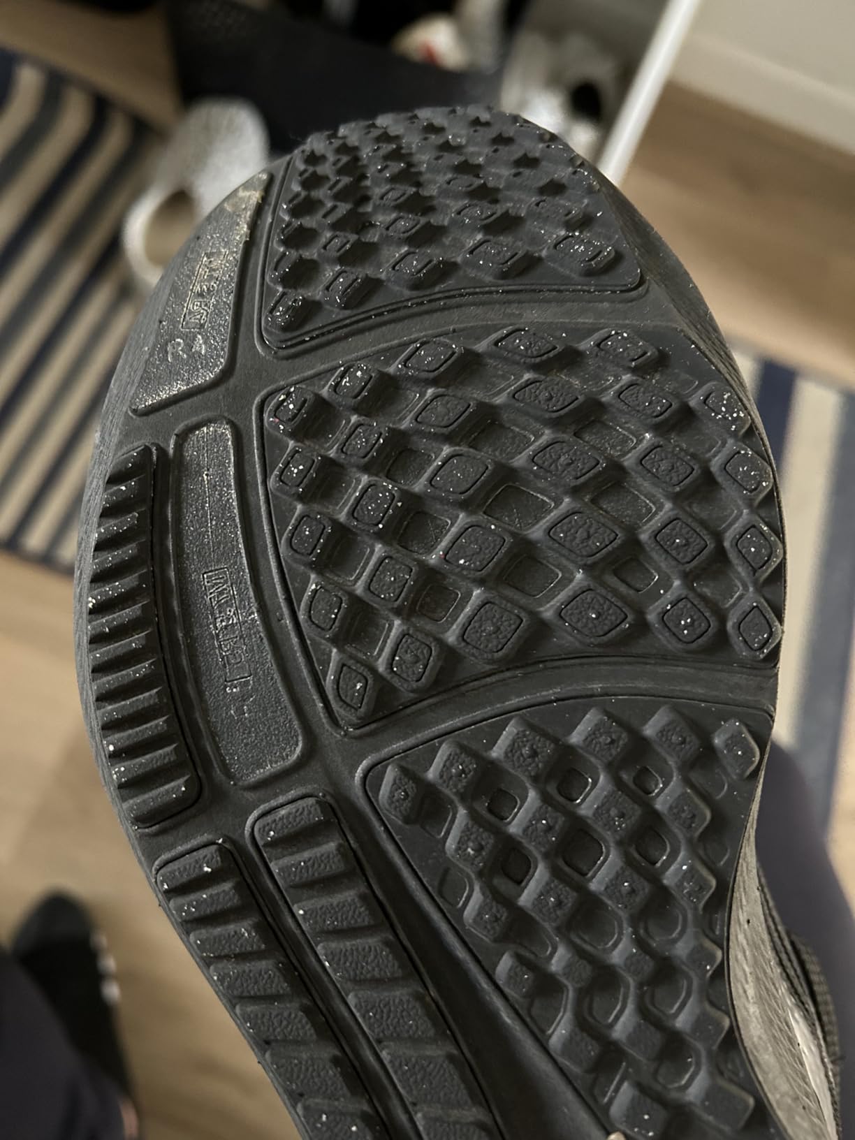 Nike Pegasus 37 sole showing tread wear after extensive testing period