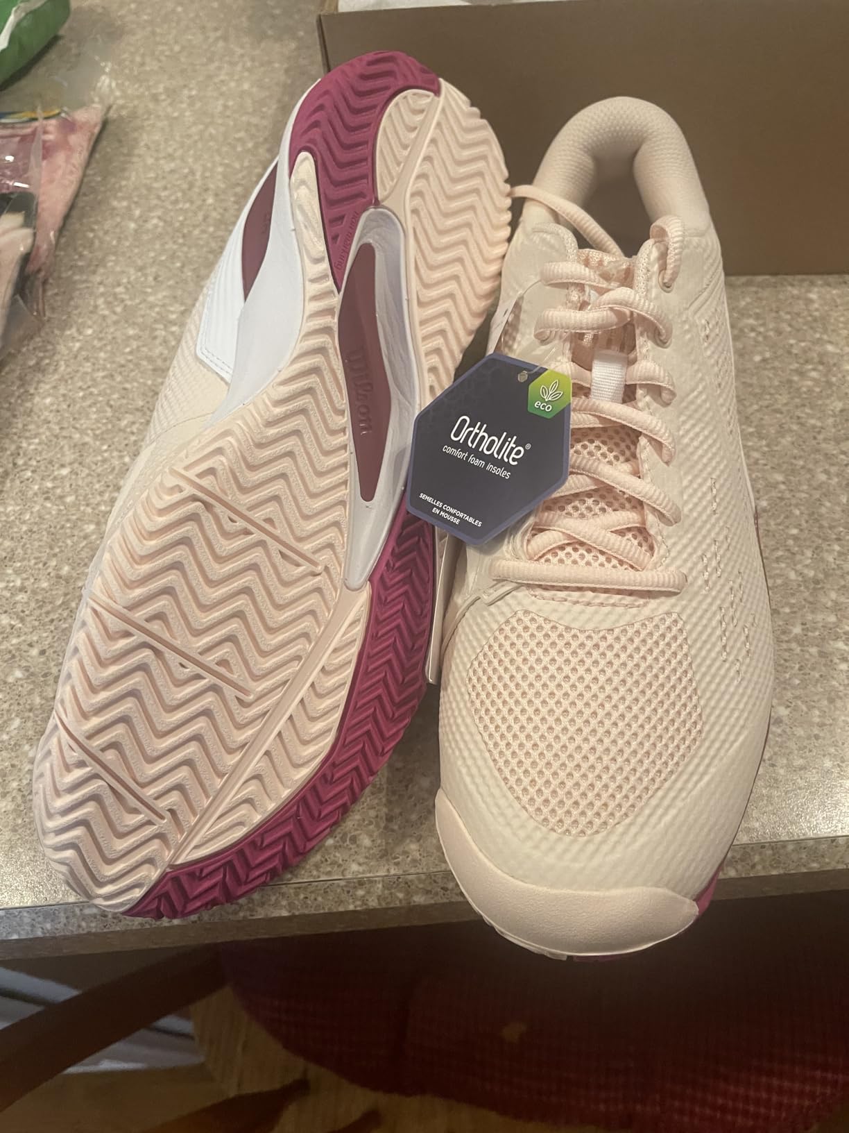 Wilson tennis shoes in action on court showing outsole traction pattern and lateral support