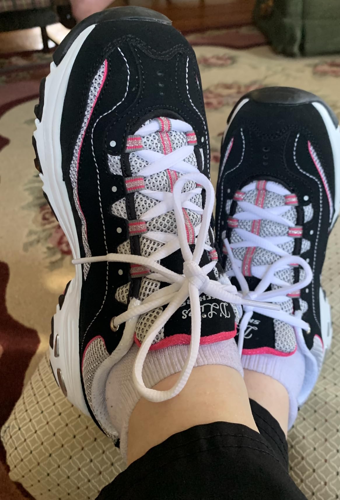 A customer photo showing off their new Skechers D'Lites, looking happy with the purchase.