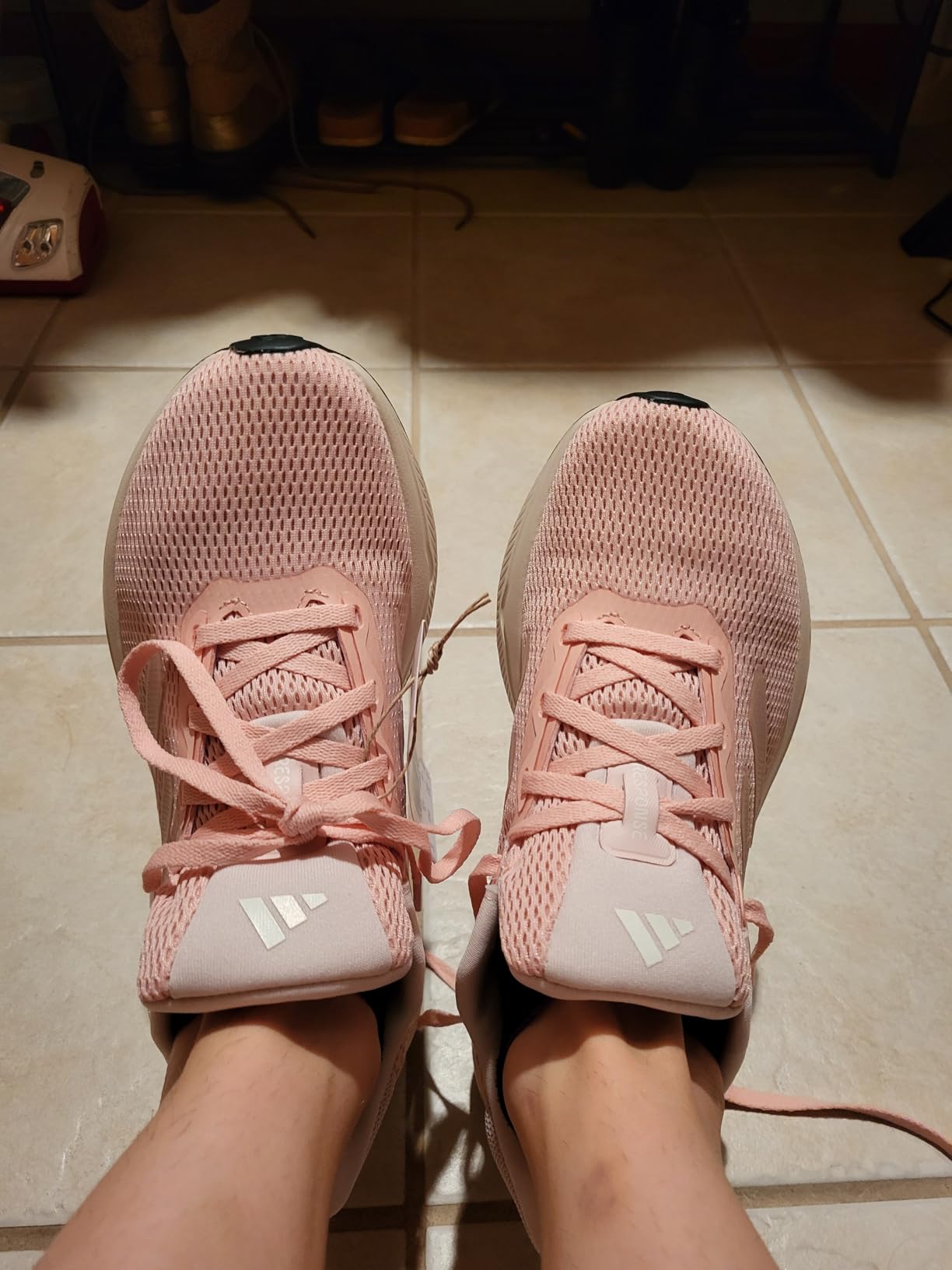 Side profile showing Adidas Women's Response shoe sole design and midsole technology